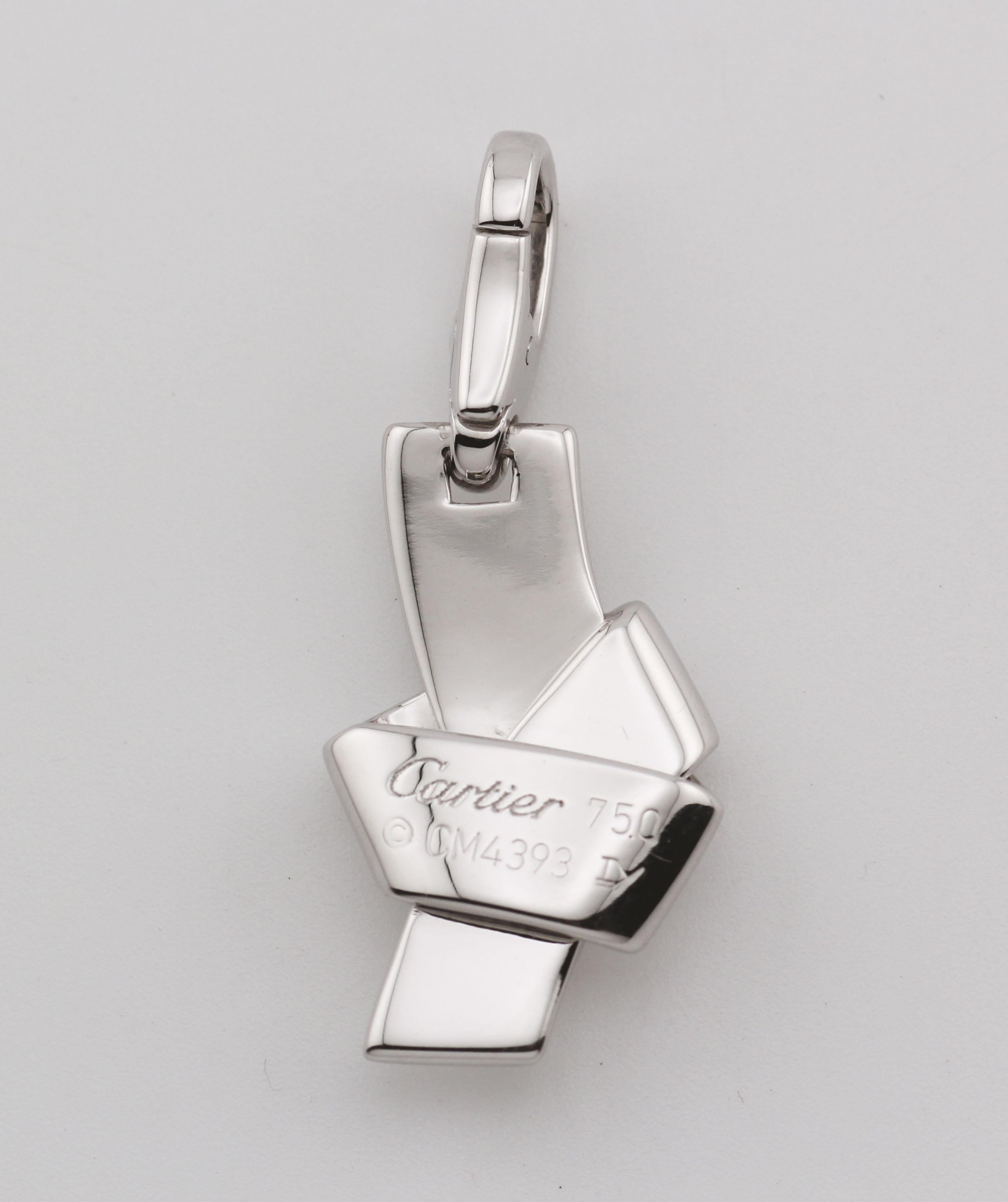 The Cartier Diamond 18K White Gold Knot Charm Pendant is a masterful embodiment of elegance and sophistication, seamlessly blending timeless design with contemporary flair. Crafted from luxurious 18K white gold, this charm features a meticulously