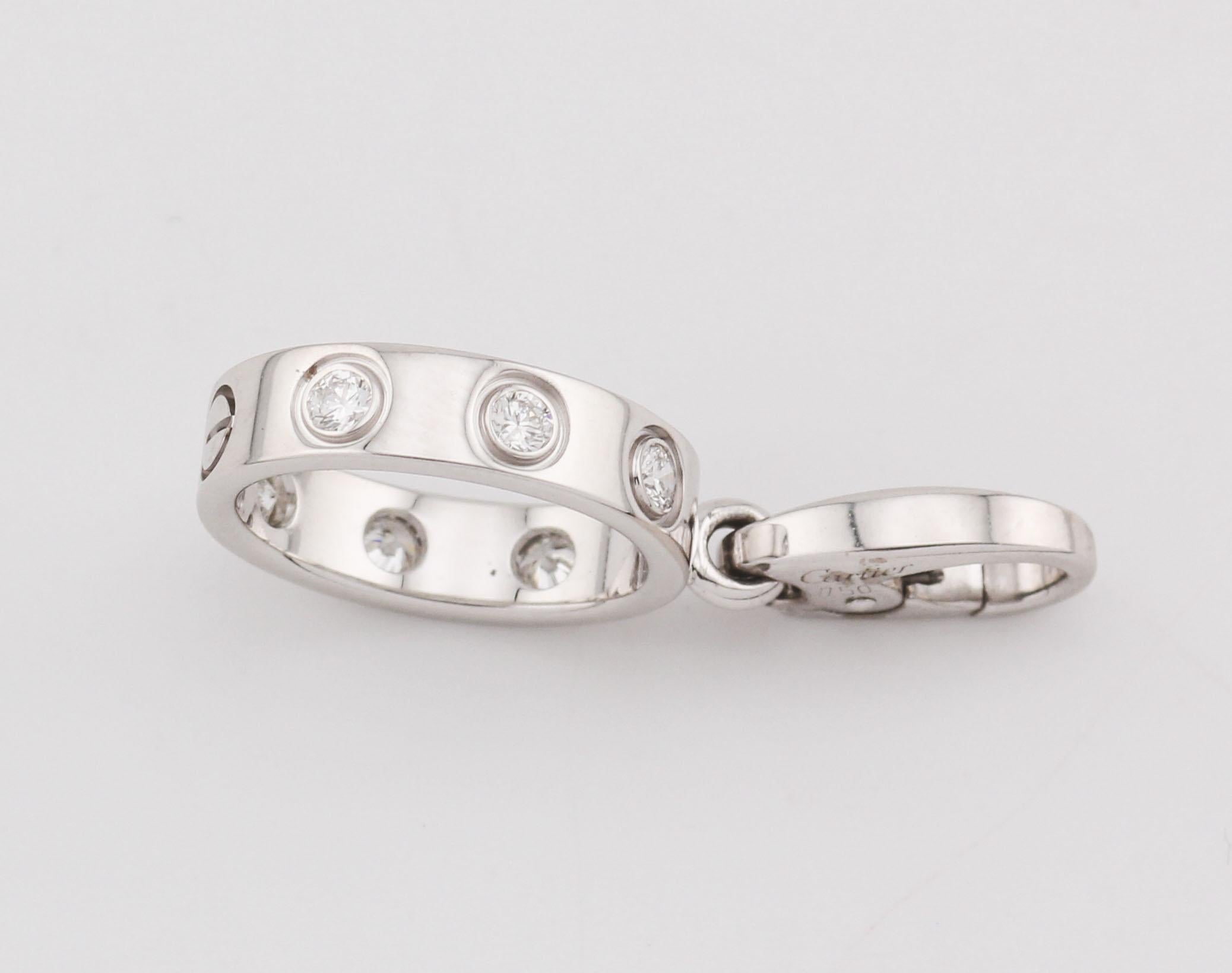 The Cartier Diamond 18k White Gold Love Bracelet Charm is a stunning, elegant piece that exemplifies the iconic design and luxurious craftsmanship of Cartier. This charm is crafted from 18k white gold, giving it a sleek, polished finish that