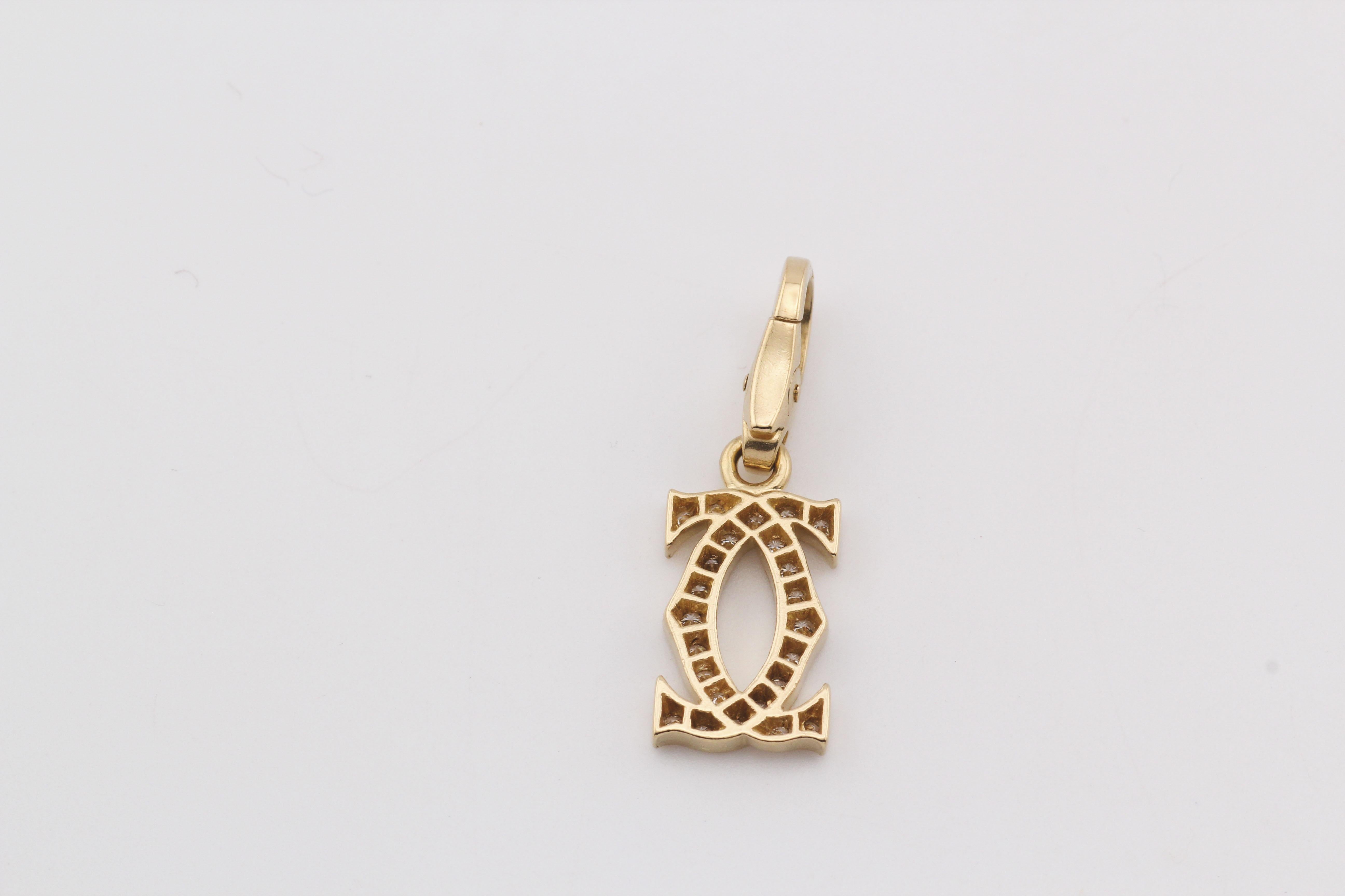 Elevate your style with the Cartier Diamond 18 Karat Yellow Gold Double C-Logo Charm, a symbol of timeless elegance and luxury. This exquisite charm seamlessly blends Cartier's iconic design with the brilliance of diamonds and the sophistication of