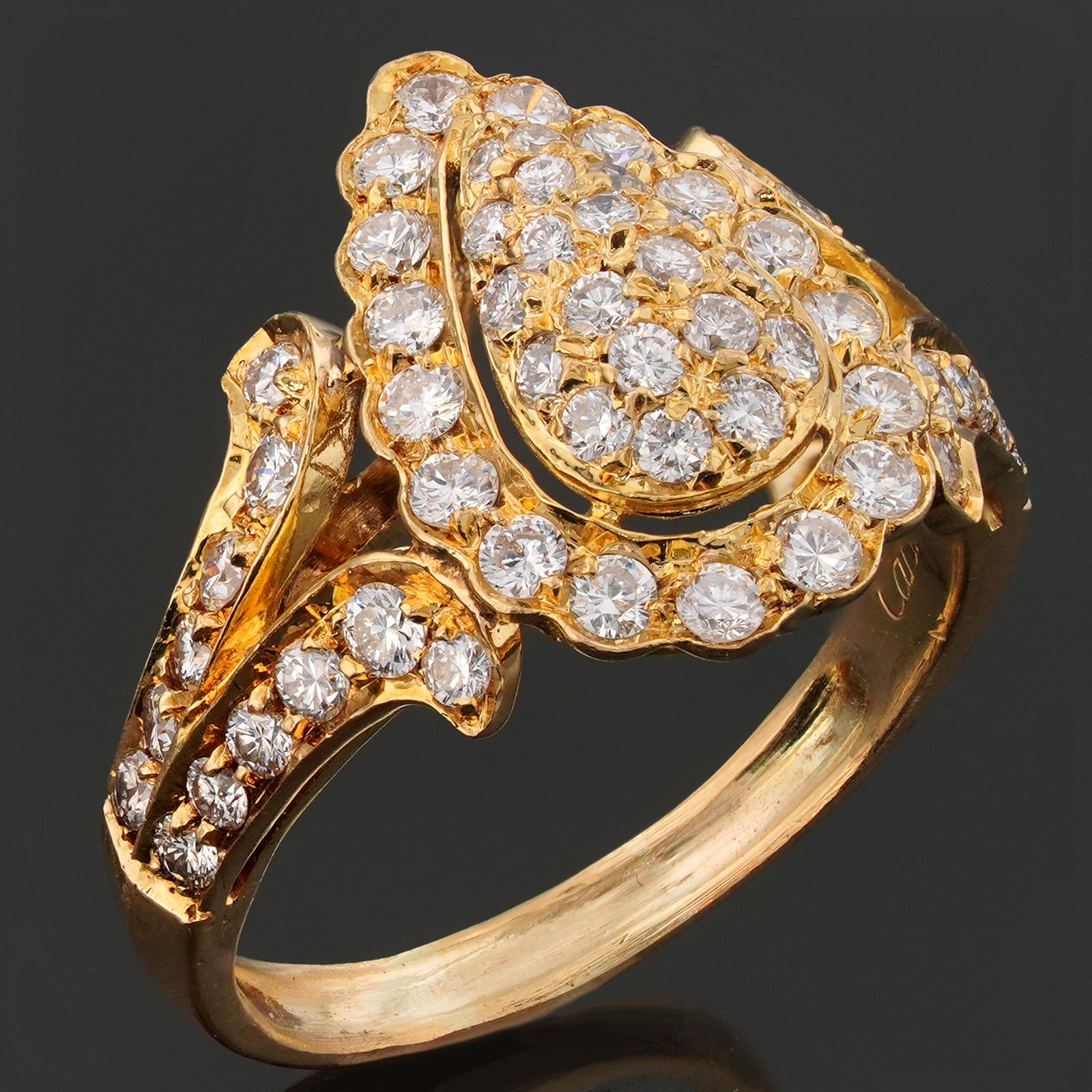 Cette magnifique bague vintage de Cartier est réalisée en or jaune 18 carats et sertie de diamants ronds de taille brillant D-F VVS1-VVS2. Fabriqué en France dans les années 1980. Dimensions : 0,70