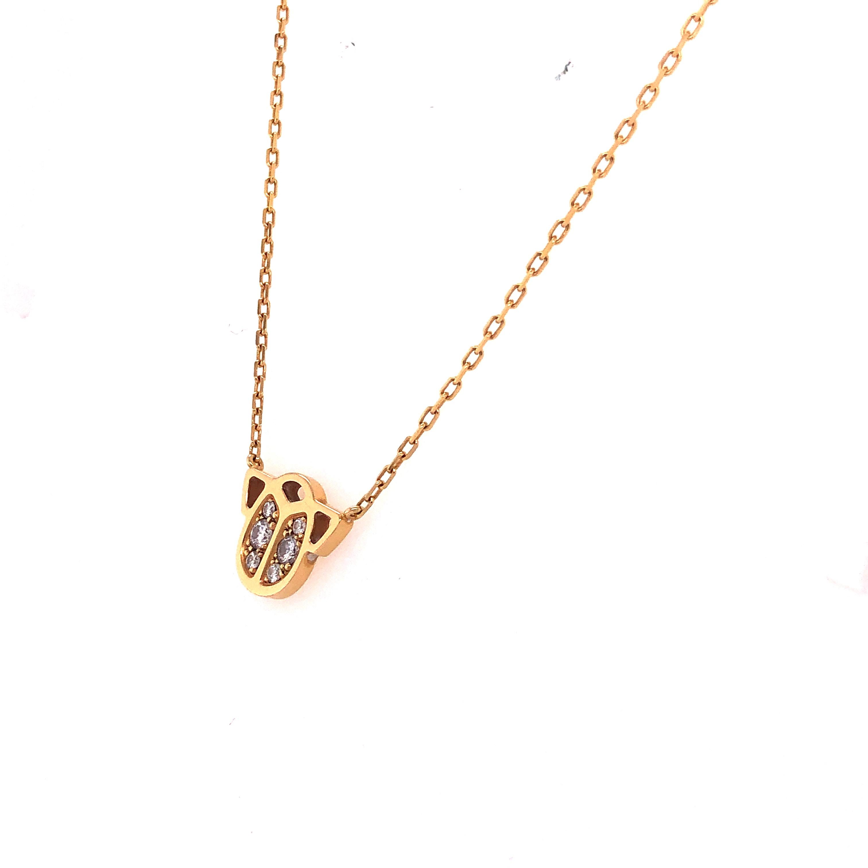 An elite authentic pendant and chain necklace by Cartier from the Scarab collection. Crafted from 18k yellow gold with a high polished finish. The pendant features an Egyptian Scarab beetle adorned with 0.10 carat of diamonds and it is attached to a