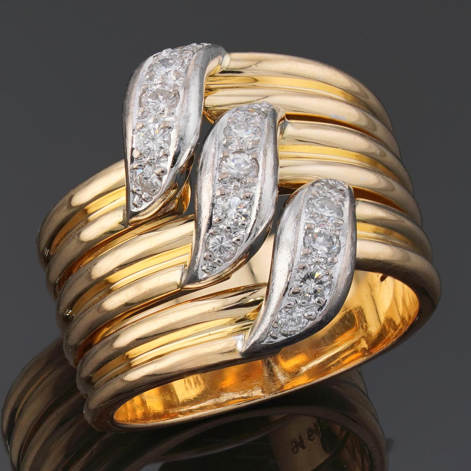 Cette fabuleuse bague Cartier présente un large anneau en or jaune 18 carats serti de diamants ronds de taille brillant E-F-G VVS1-VVS2 dans des accents d'or blanc. Fabriqué en France dans les années 1980. Dimensions : 0,70