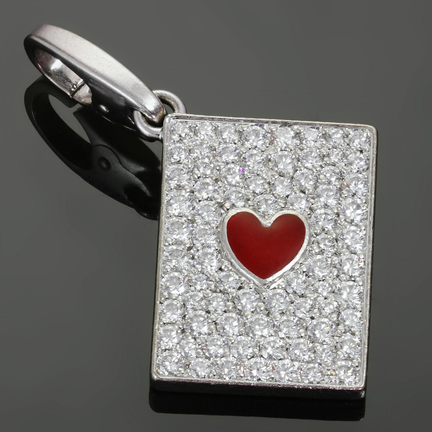 This authentic rare Cartier pendant is crafted in 18k white gold and features a red enamel heart in the center surrounded with about 80 pave brilliant-cut round D-E-F VVS1-VVS2 diamonds weighing an estimated 1.50 carats. The reverse of the charm