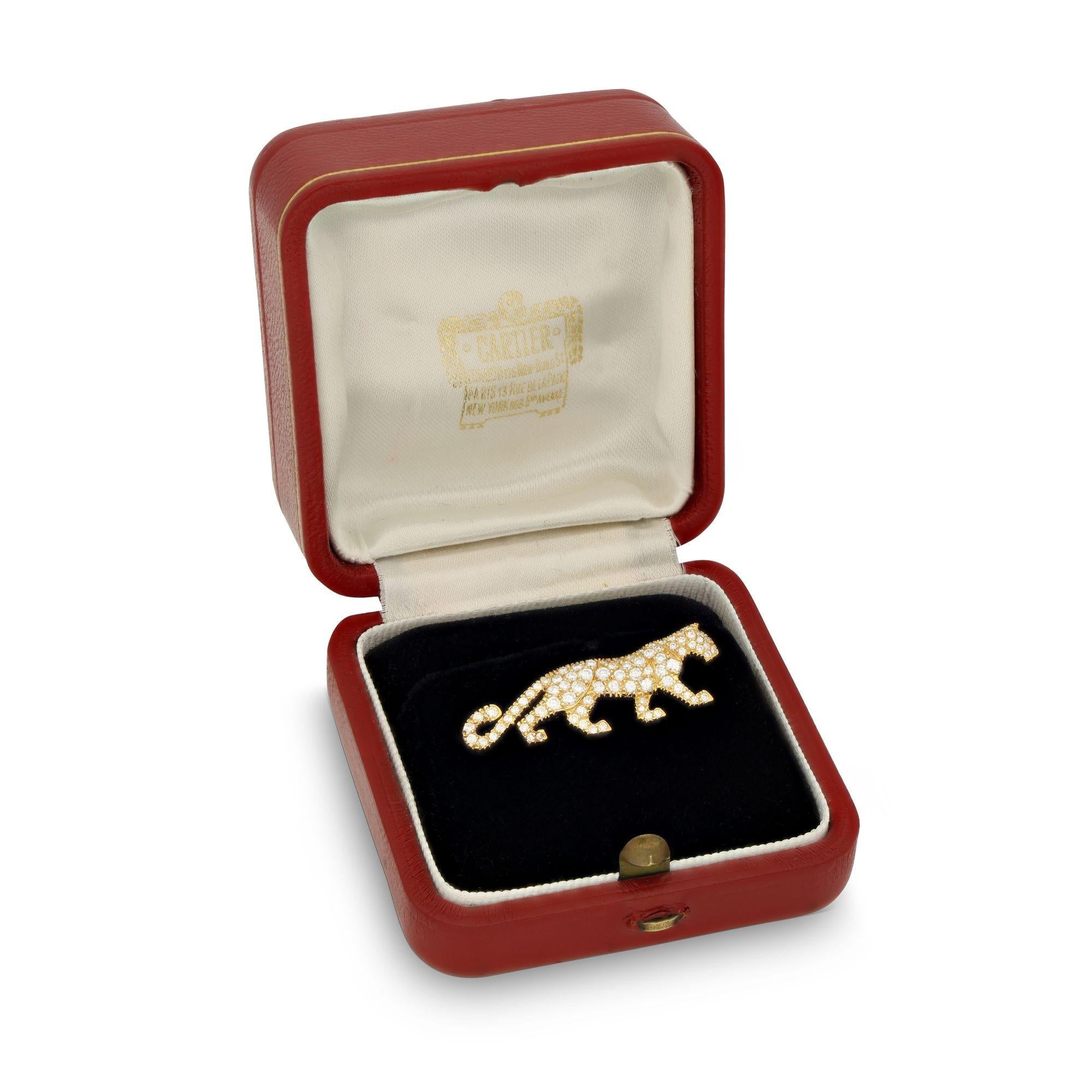 A diamond and yellow gold 'Mahango' panther pin by Cartier. Designed as a walking panther, fully pavé set with white brilliant cut diamonds set in 18ct yellow gold. A single pin on the reverse, secured by a lapel pin back.
Maker
Cartier
Period
Circa