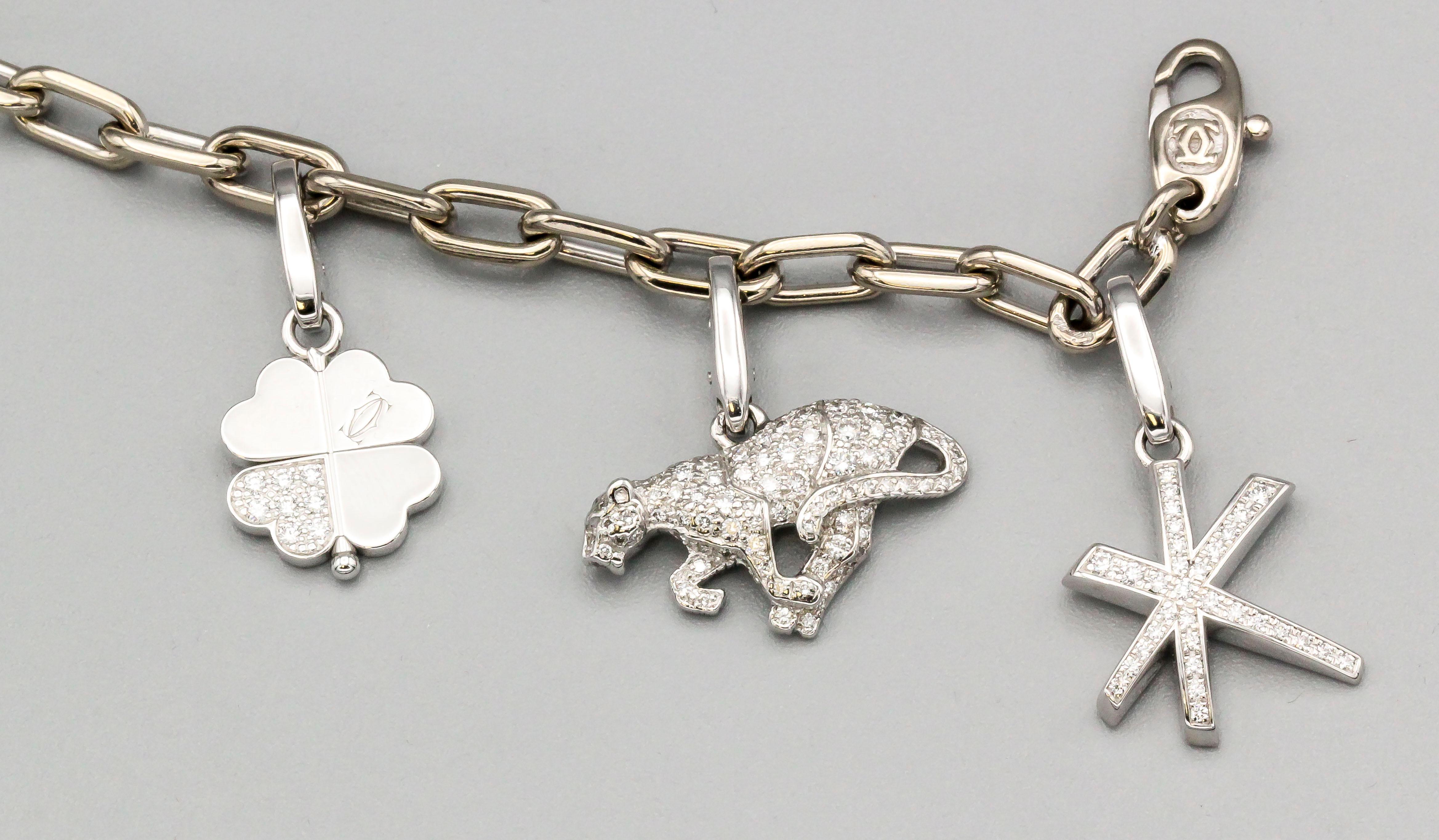 Cartier Diamond and 18 Karat White Gold 7 Charm Bracelet In Excellent Condition In New York, NY
