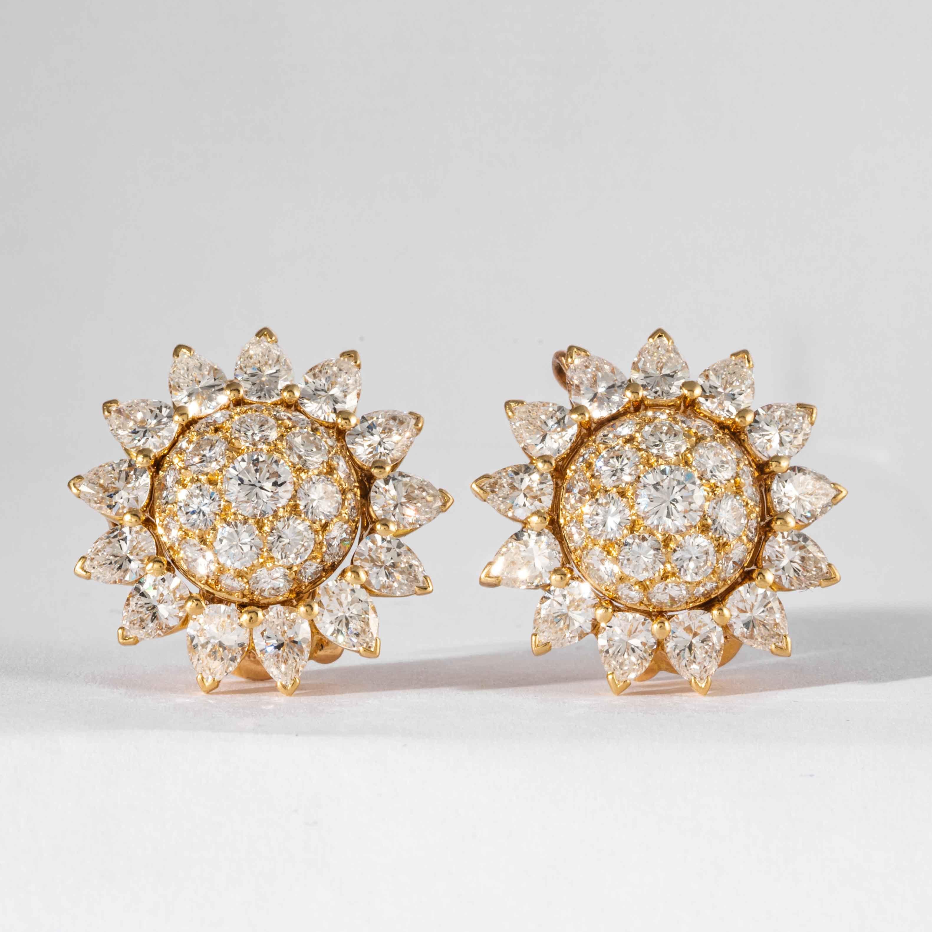 Cartier Diamond and 18kt Yellow Gold Sun Flower Motif Cluster Earrings, consisting of 25 pear shape diamonds and 44 full cut round diamonds, having a total approximate weight of 7.00 carats of colorless and VS1-VS2 clarity. Earrings have well