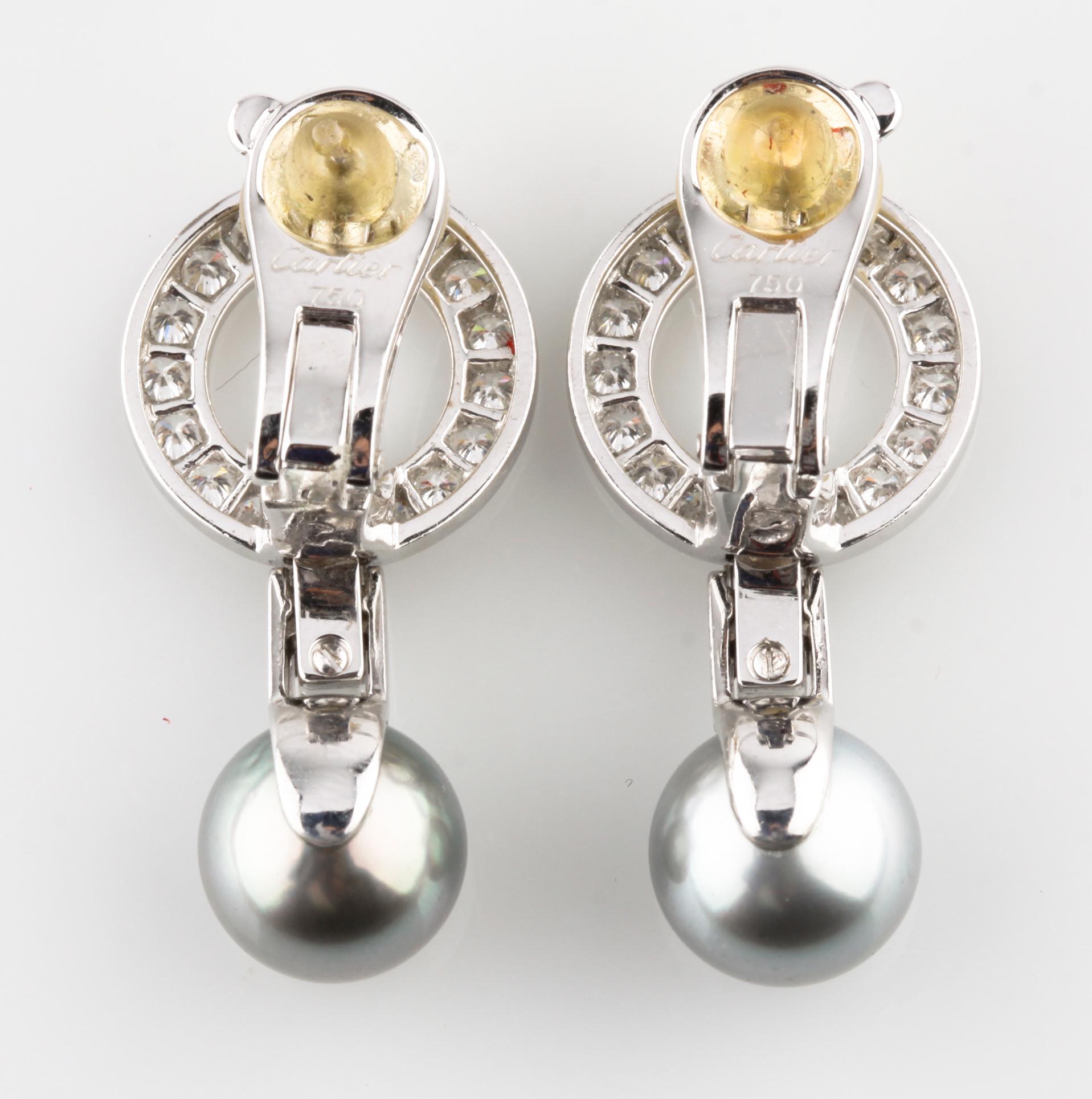 Gorgeous Vintage Omega Back Cartier Earrings
Feature Two Gray Pearls Dropping from Trademark Cartier Diamond Agrafe Design
Total Length of Each Earrings = 1.125