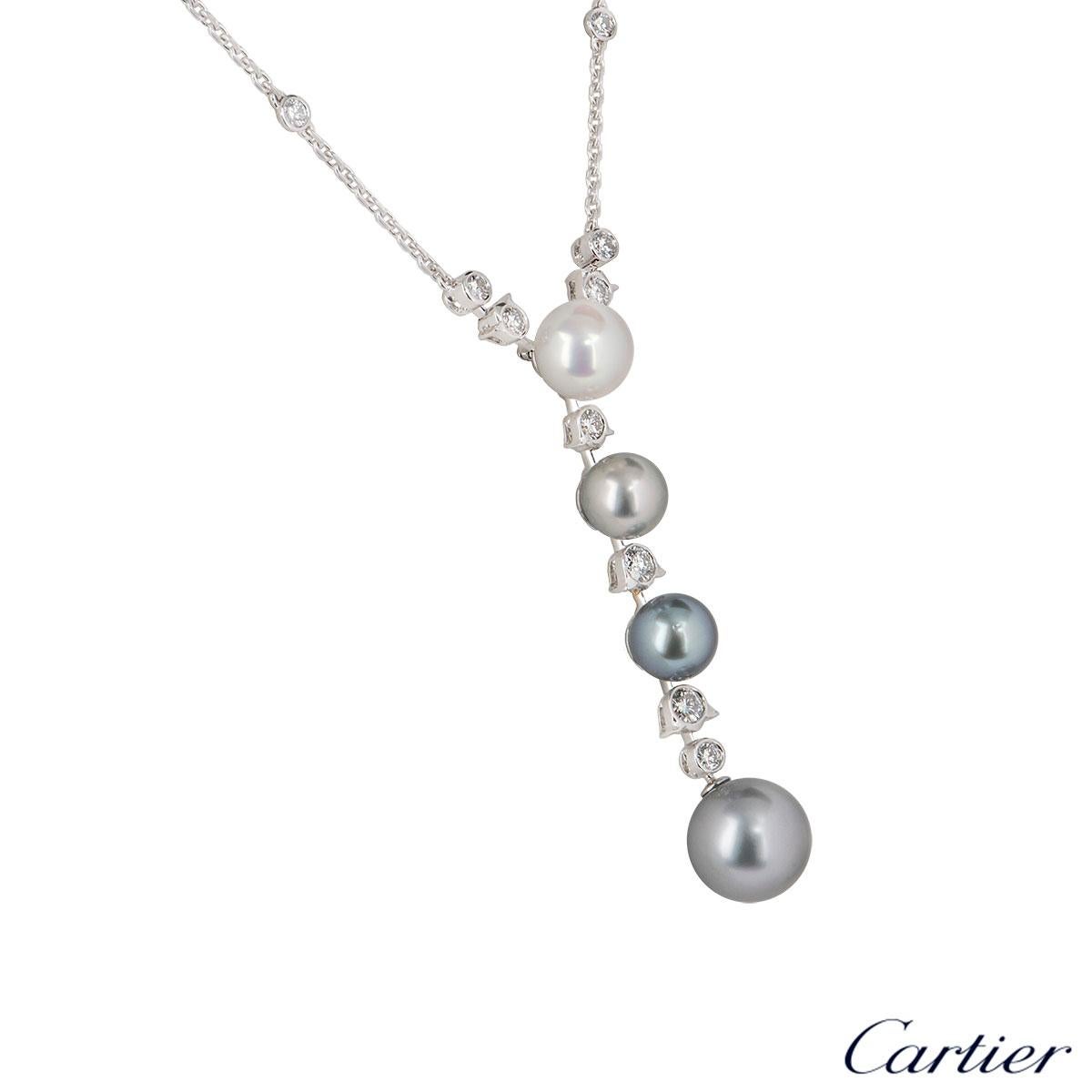 A stunning white gold pearl and diamond necklace by Cartier from the Calin collection. The necklace comprises of 4 pearls Tahitian and cultured suspended at the bottom alternating in sizes with 16 round brilliant cut diamonds also in alternating