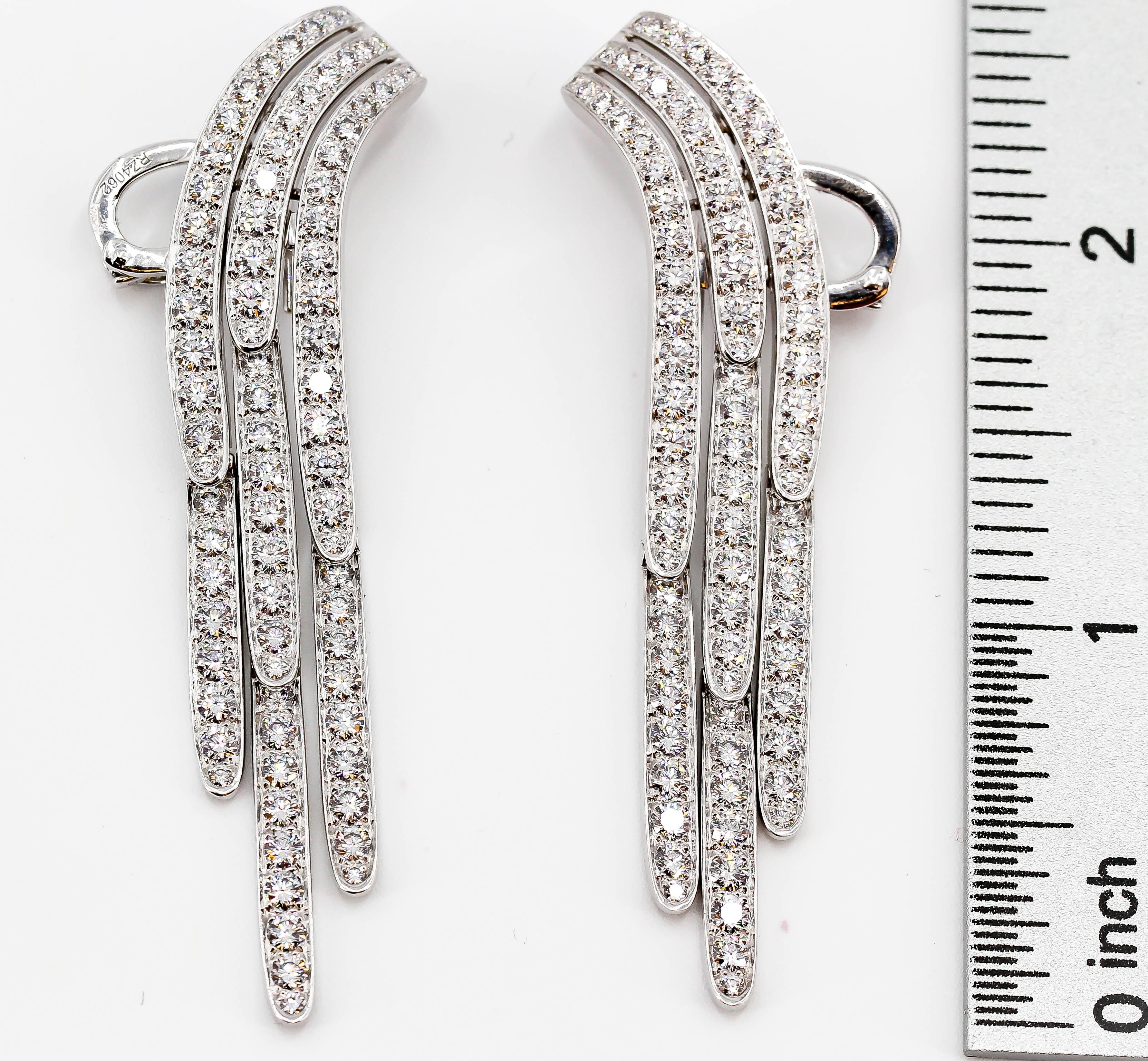 Chic diamond and platinum drop earrings by Cartier. They feature very high grade round brilliant cut diamonds of approx. E-G color, VVs clarity, total diamond weight approx. 10 carats.

Hallmarks: Cartier, PT950, reference numbers, French platinum