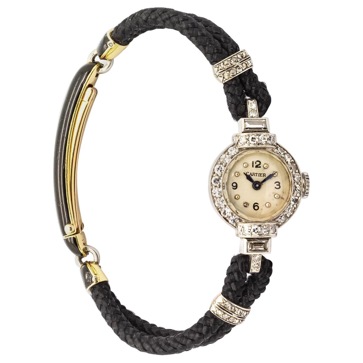 Rétro Montre-bracelet en diamant et platine de Cartier en vente