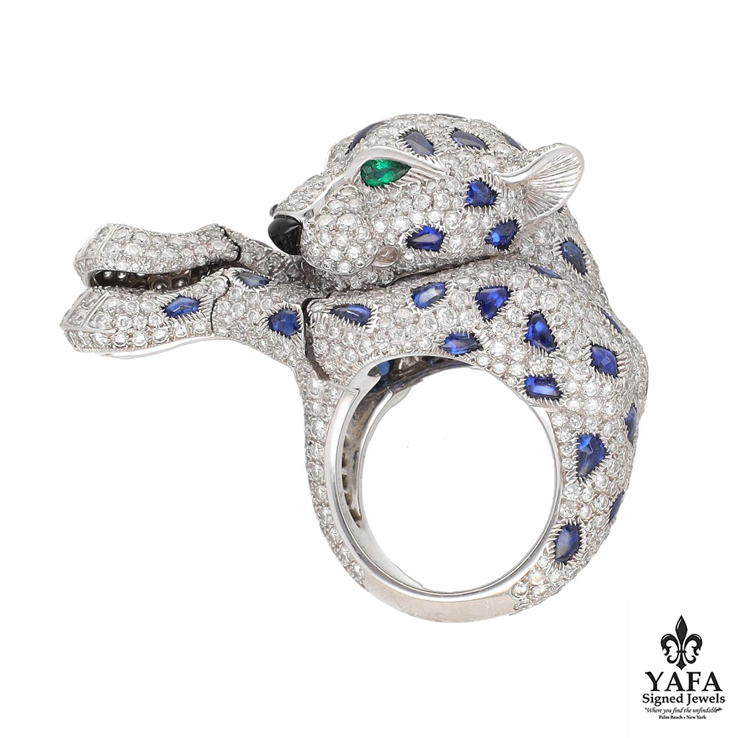 Cartier Diamond and Sapphire, Emerald and Onyx - Articulated Paws Panther Ring.
Approximately Diamond Weight 4.50 CTS, Embellished with Sapphire Spots, Emerald Eyes and an Onyx Nose.
Size 53 / 6.25
French Assay Marks
Signed - Cartier