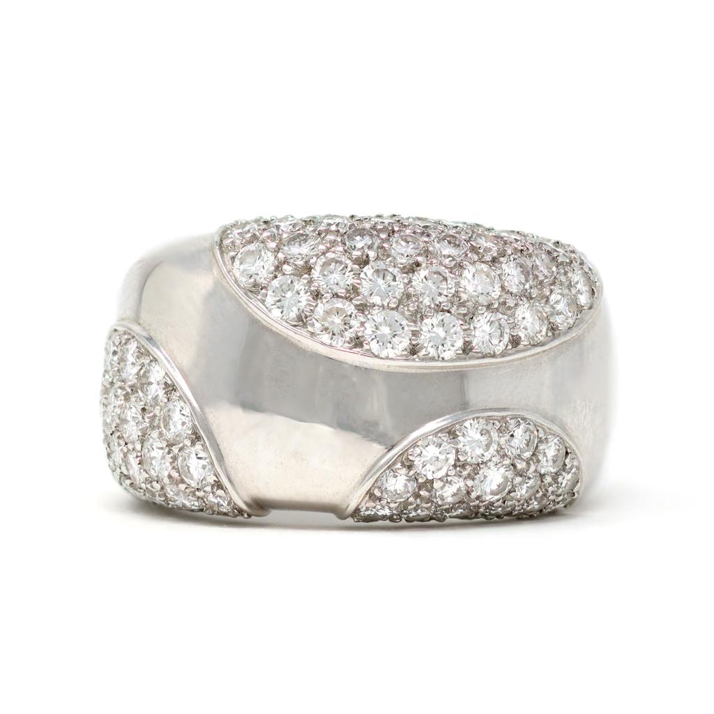 A classic diamond and white gold band ring by Cartier France. From the collection la Nouvelle Vague, the ring is set in 18 karat and designed with 3 pave diamonds curvatures. The diamonds have an estimated carat weight of 1.70 carats, FG color and