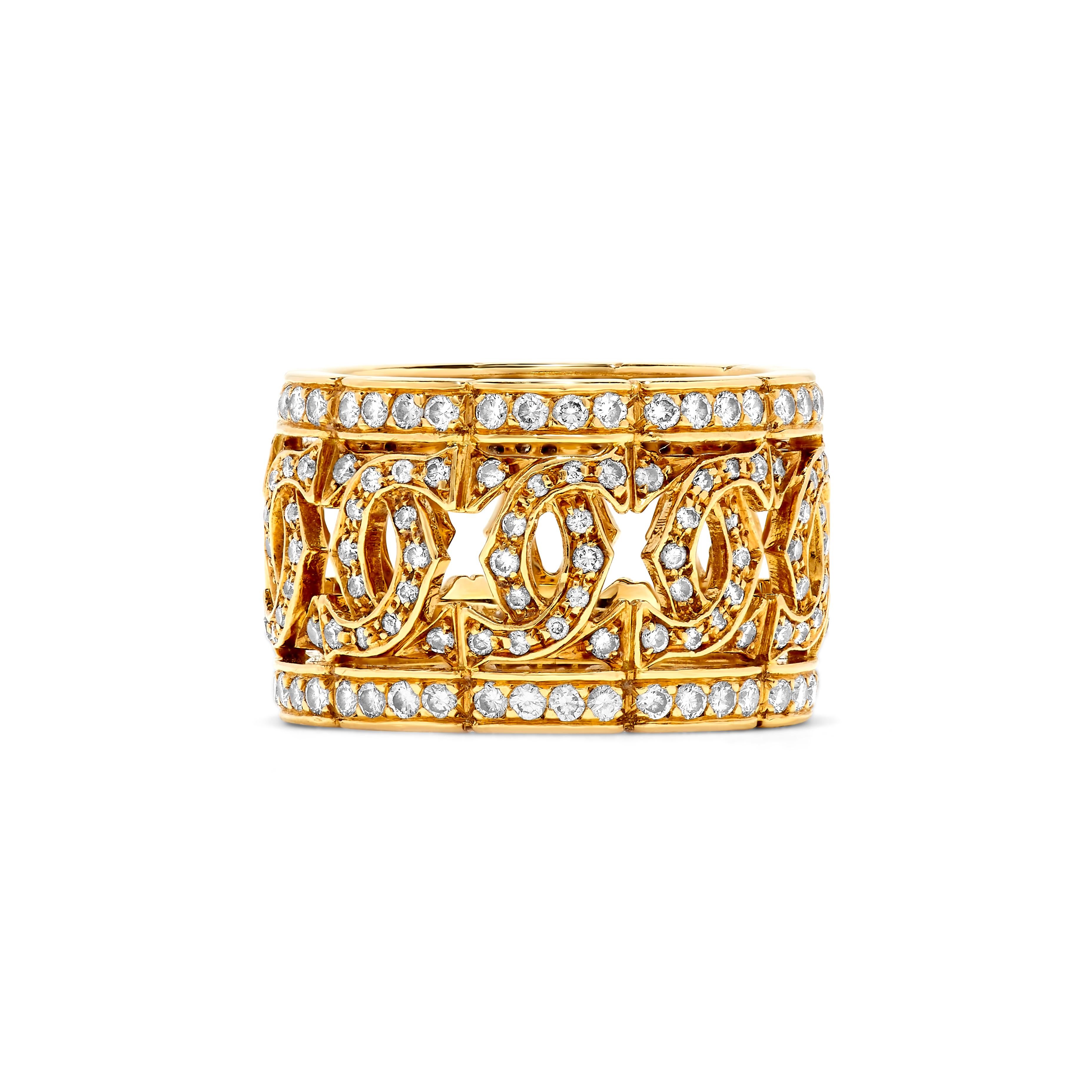 This classic Cartier diamond ring features approximately 2.00 carats of F-H, VVS-VS round diamonds. Mounting stamped 750 for 18K Yellow gold. Size 5 1/2. Approximately 1/2 inch width. Signed Cartier. Numbered 714133, with French workshop mark. Circa