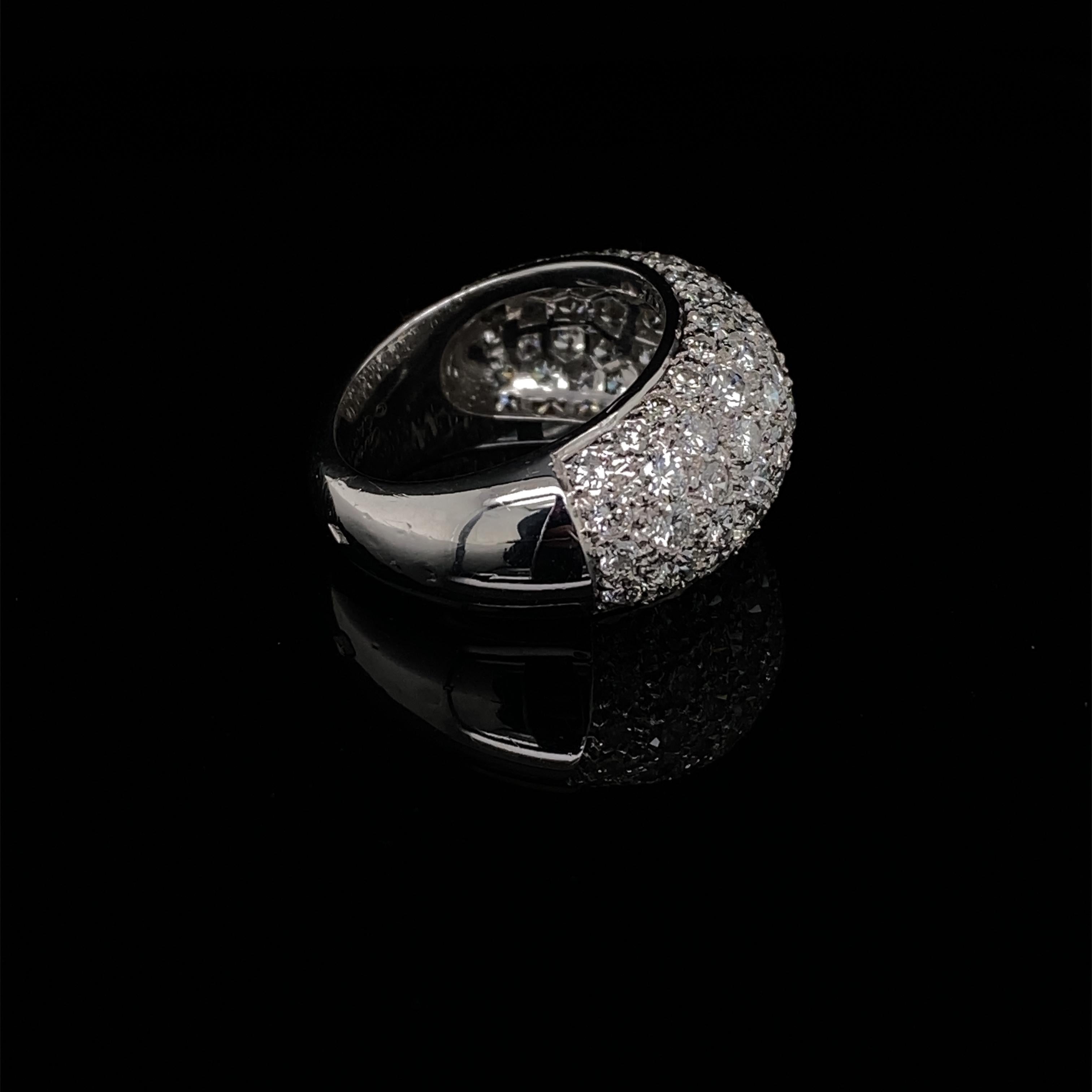A Cartier diamond bombé 18 karat white gold ring.

Eye-catching and bold, this ring is pavé set with round brilliant cut diamonds of approximately 3.20 carats, G VS quality.
The glamour of bombé rings are due to their larger overall shape on the