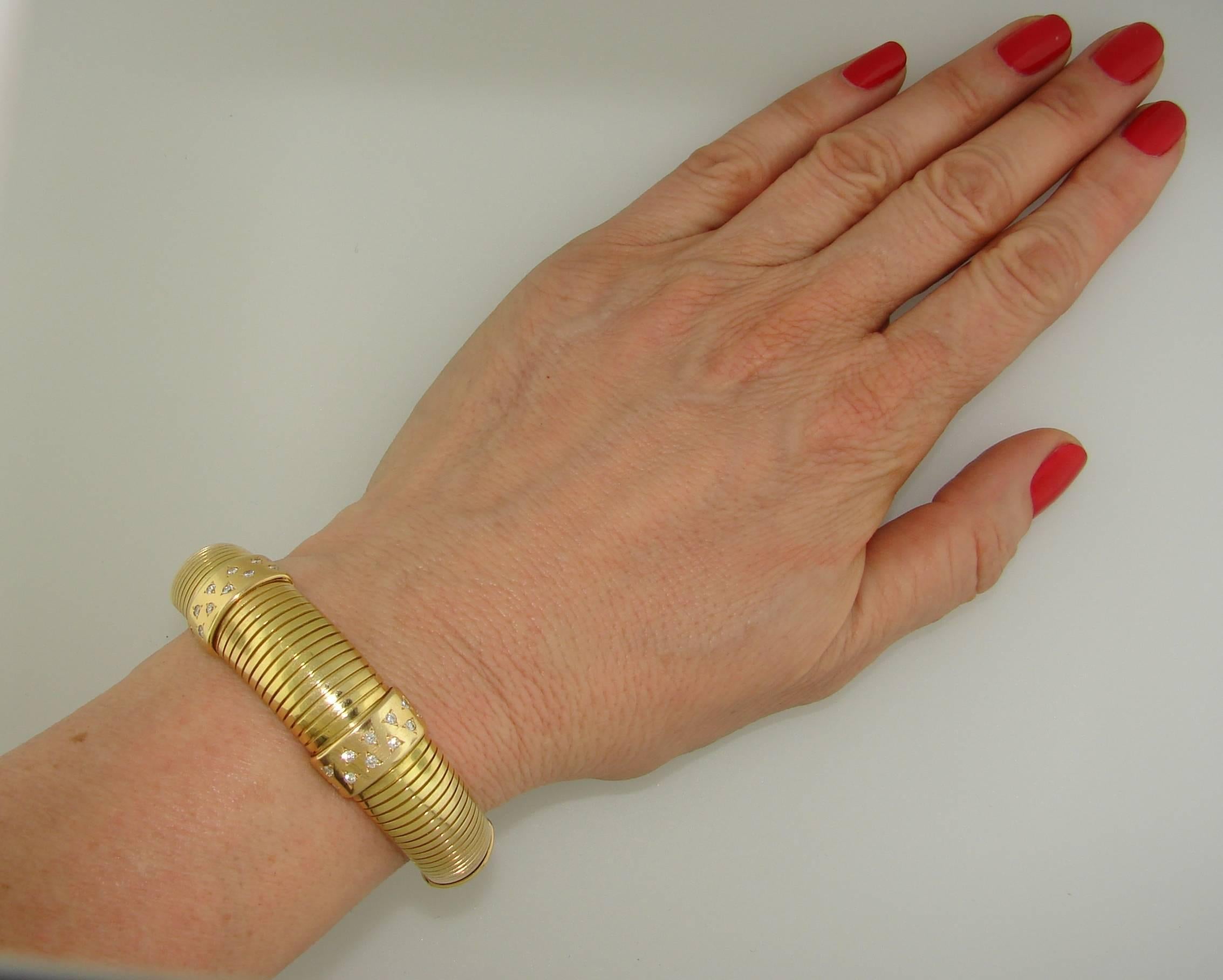 A chic Cartier bracelet in a Tubogas design, crafted from 18k gold, featuring diamonds. The gems are set across four gold bands, dividing the Tubogas into five sections. The diamonds accented by subtle triangle notches that enhance their
