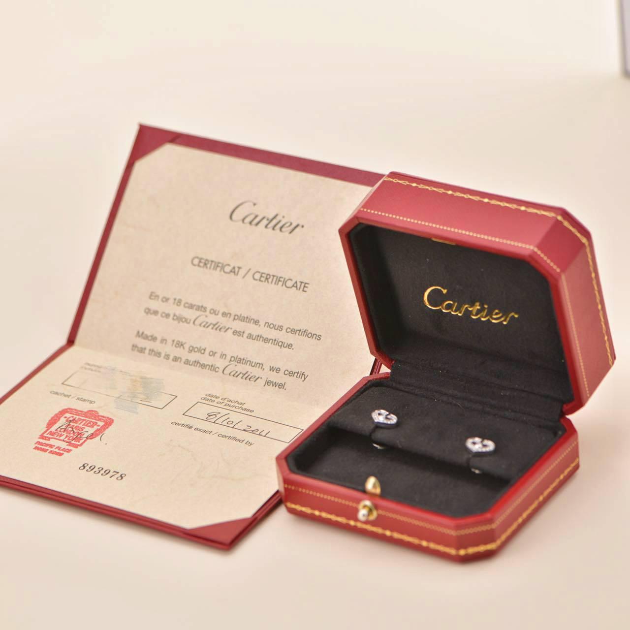 SKU	AT-1528
Brand	Cartier
Model	C Hearts de Cartier
Date	Circa 2011
Serial No.	PU****
_________________________________________________
Metal	18K White Gold
Stone	Diamond (Approx. 0.17ct)
Weight	Approx. 4 g
Width	Approx.