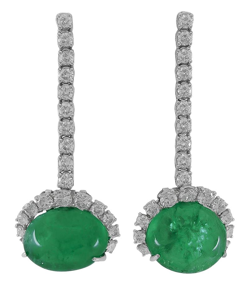 An exceptional suite by Cartier that dates back to the 1960s, comprising a necklace, bracelet, and matching ear clips, all of a similar design. Each piece is crafted with cabochon rubies and cabochon emeralds, further accentuated with brilliant