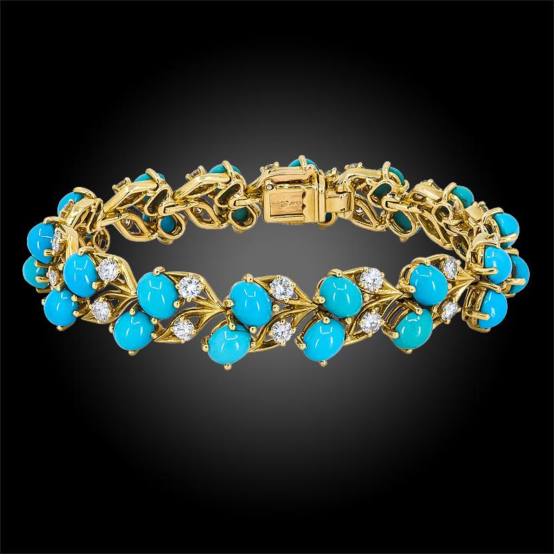 The 1960s 18k yellow gold bracelet, set with twenty-eight cabochon turquoise and diamonds, signed Cartier, French.

Approx. 6 1/2″ long
