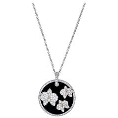 Cartier Diamond Caresse D'orchidées Collier pendentif rond en or blanc et onyx