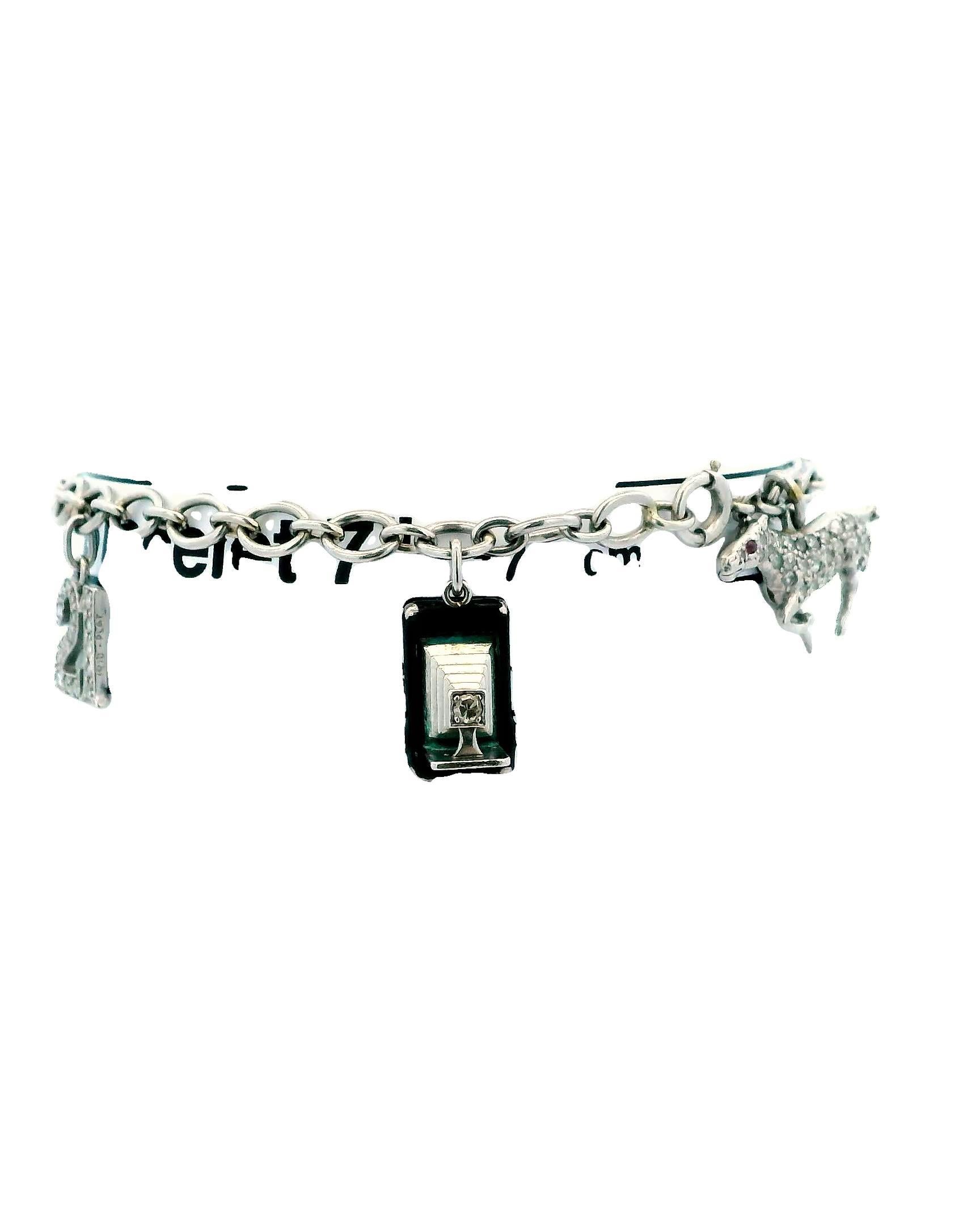 Cartier Diamond Charm 1937 in platinum Bracelet, showcasing six charms: the number 21, a camera, a riding horse, a sailboat, an airplane, and the year 1937. Each charm is adorned with mixed-cut brilliant diamonds. The bracelet is signed 