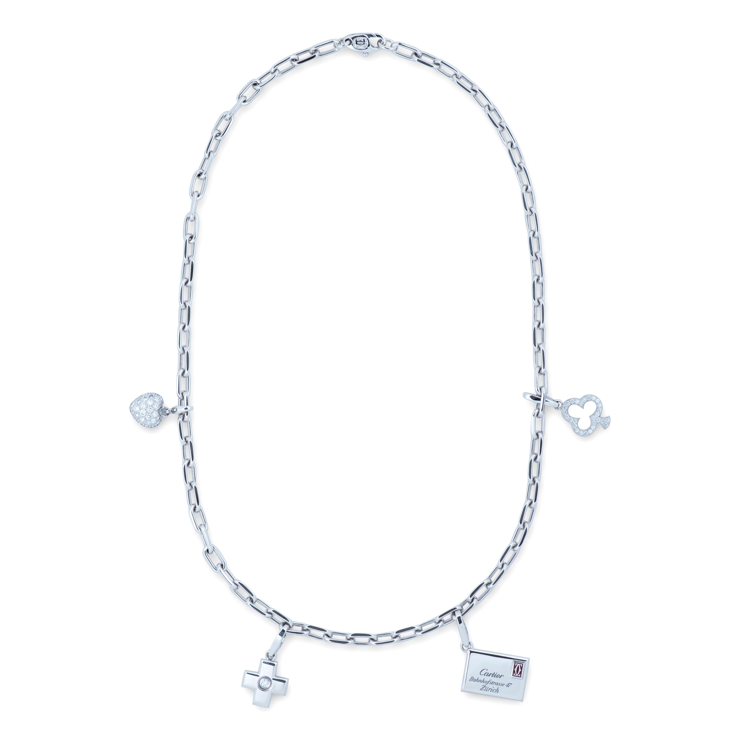 Cartier diamond charm necklace and charm bracelet set in 18k white gold, accompanied by a Cartier pouch. 

This set features 5 removeable 18kwg Cartier charms, an 18kwg Cartier necklace and 18kwg Cartier bracelet.  The necklace measures 18