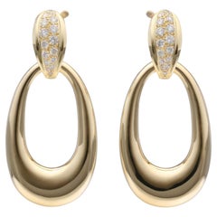 Boucles d'oreilles cabriolet en or jaune 18K avec diamants de Cartier