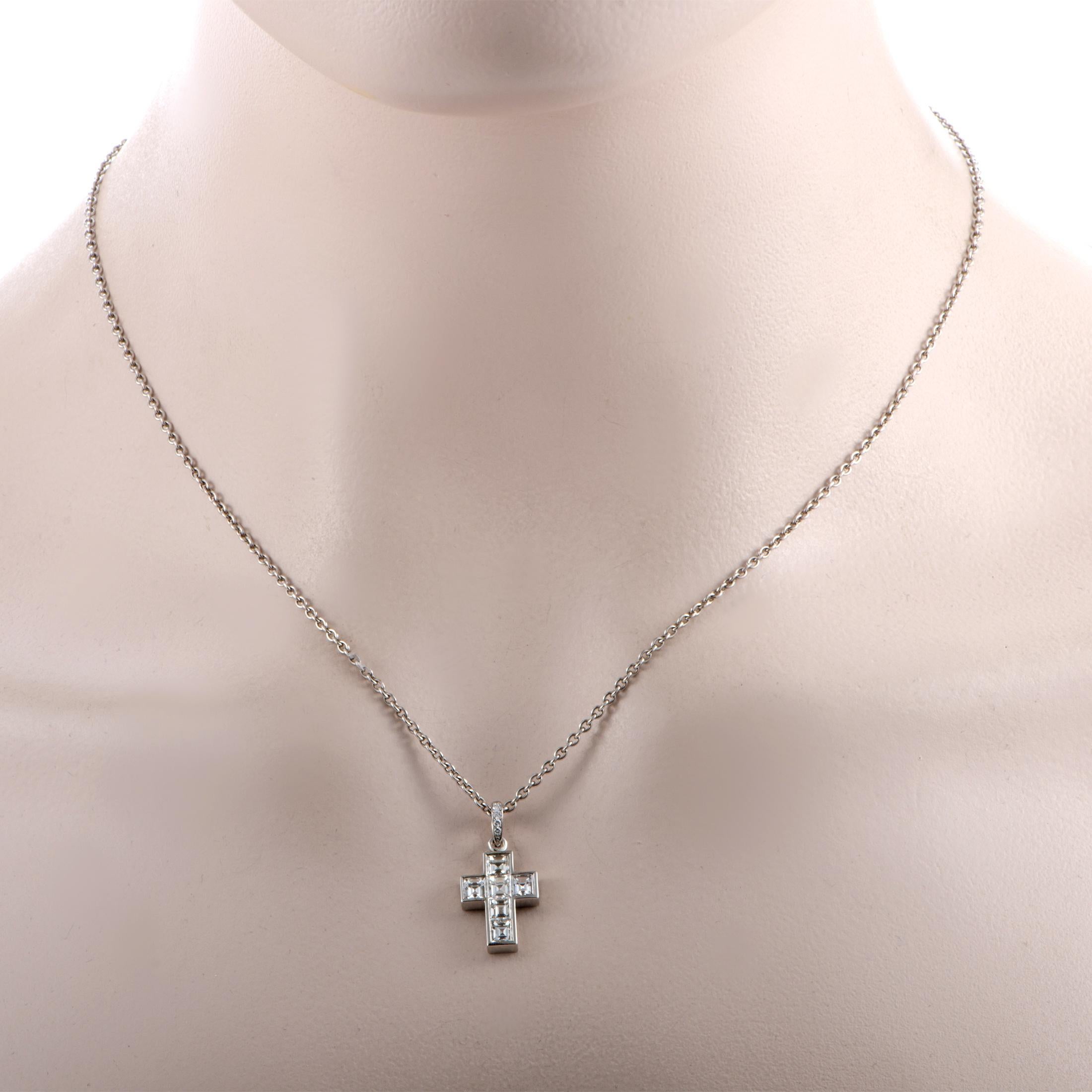 This Cartier necklace is crafted from platinum, featuring an 18” chain with lobster claw closure and a cross pendant that measures 0.88” in length and 0.50” in width. The necklace weighs 9.8 grams and is set with a total of approximately 1.50 carats