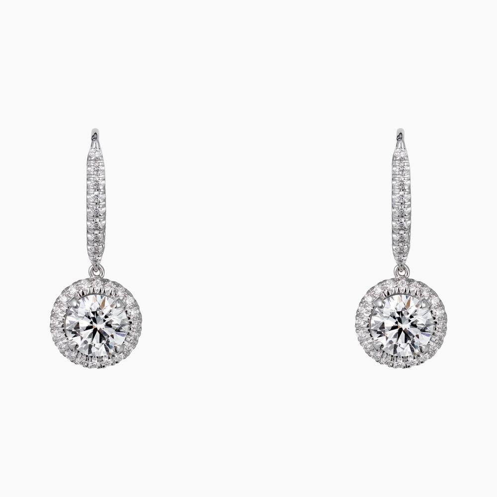 CARTIER DESTINÉE EARRINGS
White gold, diamonds
Cartier Destinée earrings, white gold 750/1000, each set with a brilliant-cut diamond available in 1.00 to 1.15 carats and 1.50 to 1.69 carats, and paved with brilliant-cut diamonds.
Cartier Paris. 
