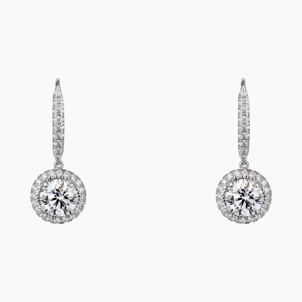 CARTIER DESTINÉE EARRINGS
White gold, diamonds
Cartier Destinée earrings, white gold 750/1000, each set with a brilliant-cut diamond available in 1.00 to 1.15 carats and 1.50 to 1.69 carats, and paved with brilliant-cut diamonds.
Cartier Paris. 
