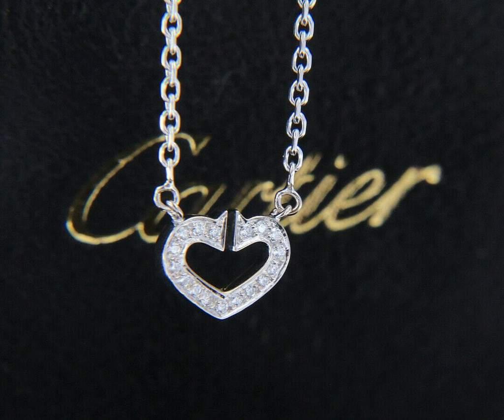 Cartier Diamond Double C Heart Pendant Necklace In 18K 

Cartier Diamond Double C Heart Pendant Necklace
18K White Gold
Diamonds Carat Weight: Approx. 0.14 CTW
Clarity: VS1
Color: E – F
Pendant Dimensions: Approx. 9.0 X 12.0 MM
Necklace Width: