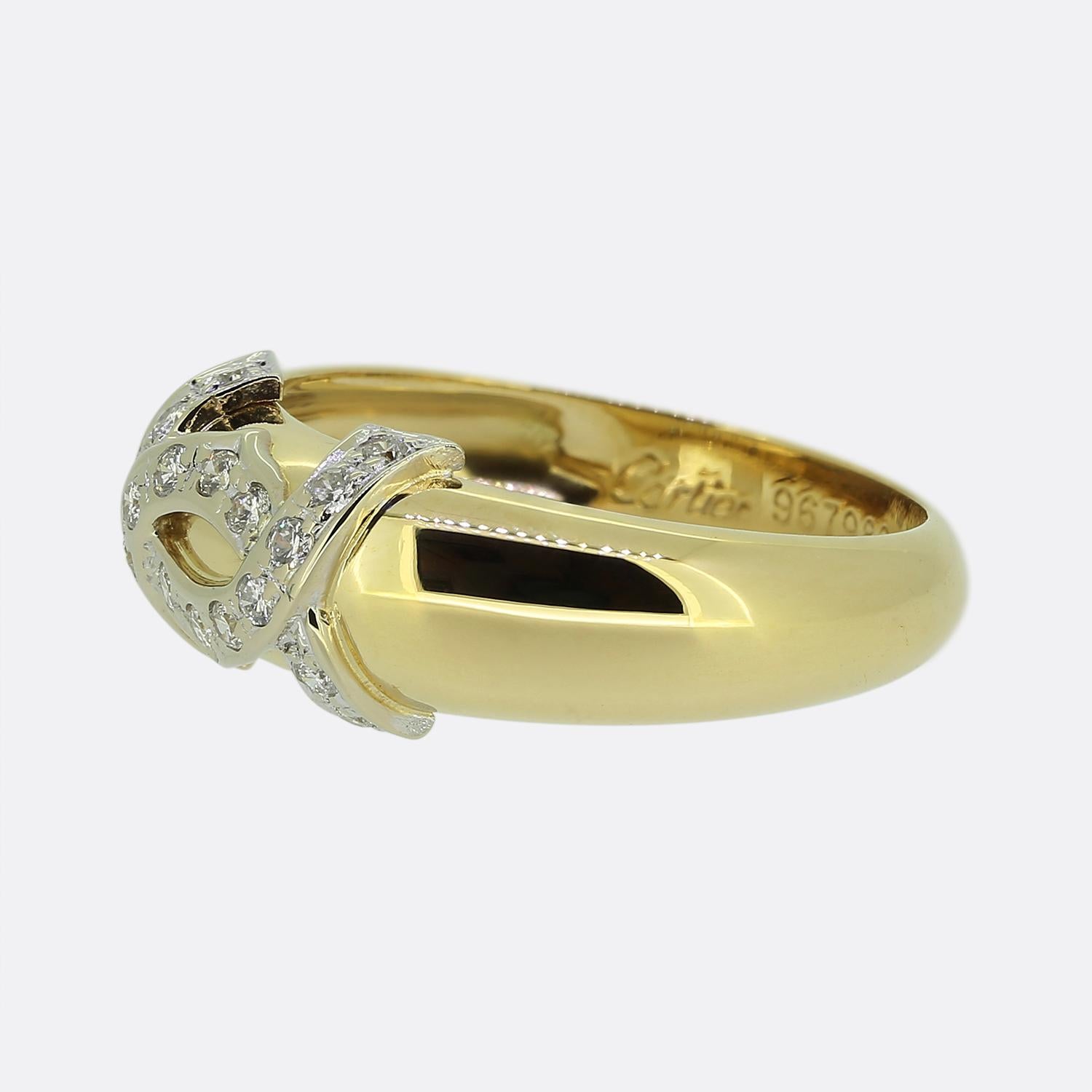 Here we have an iconic ring from the world renowned luxury jewellery house of Cartier. The band is crafted from 18ct yellow gold whilst the front of the face plays host to the double C symbol in platinum set with an array of bright white round