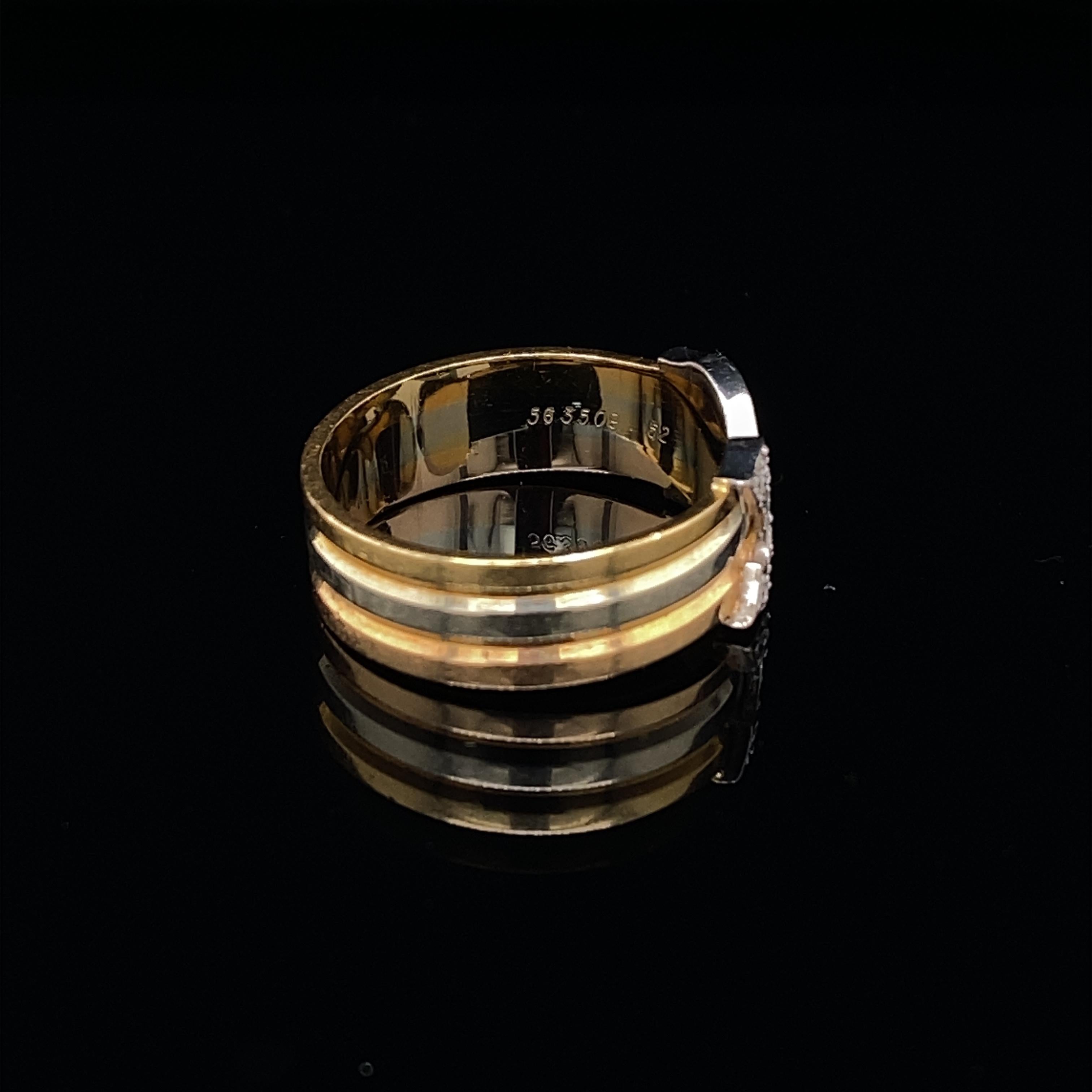 A fabulous diamond set double-C band ring by Cartier crafted in 18 karat yellow white and rose gold.

Such an incredibly wearable recognizable statement ring with the two C's pave set with round brilliant cut diamonds of 0.20 carats