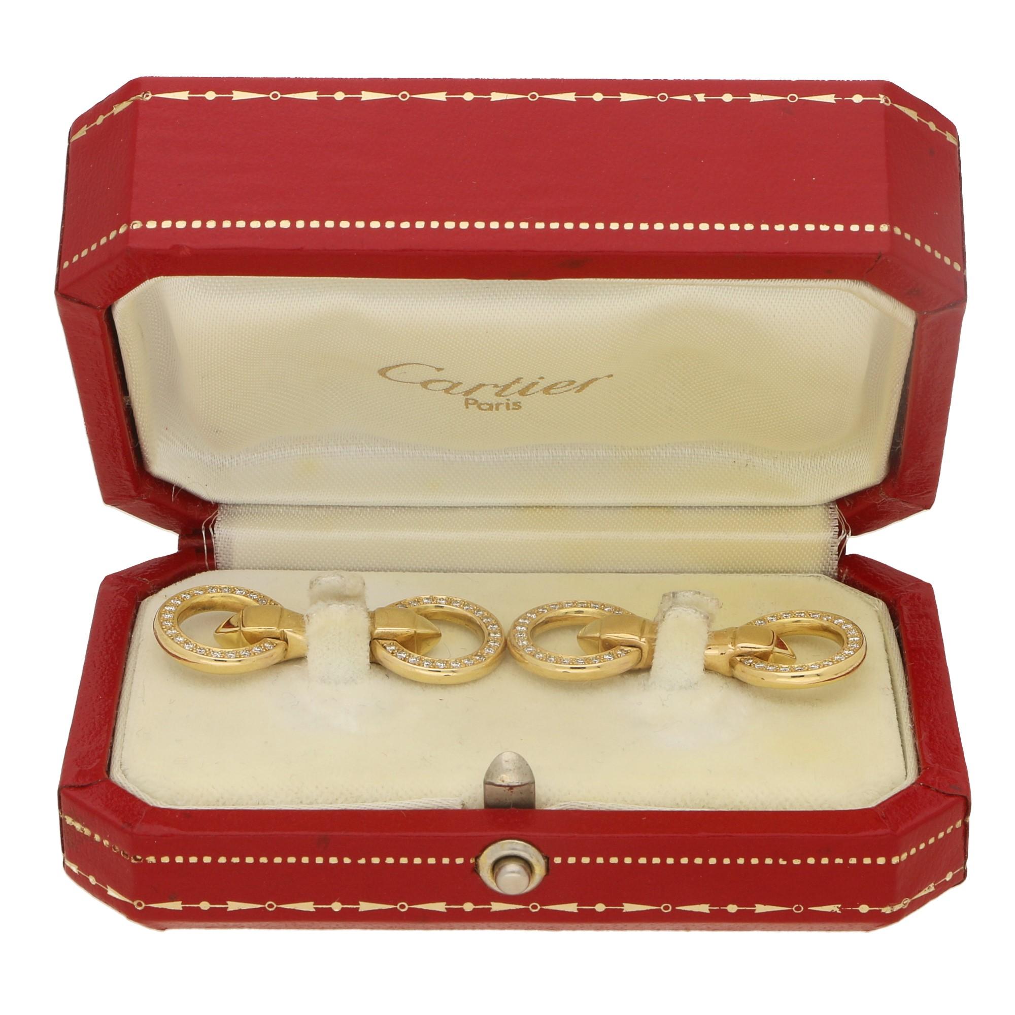  A lovely pair of signed Cartier Paris diamond double sided circle cufflinks set in 18 carat yellow gold.

These cufflinks display classic Cartier elegance with 21 diamonds mille-grain set to either side of the cufflink (84 diamonds in total). These