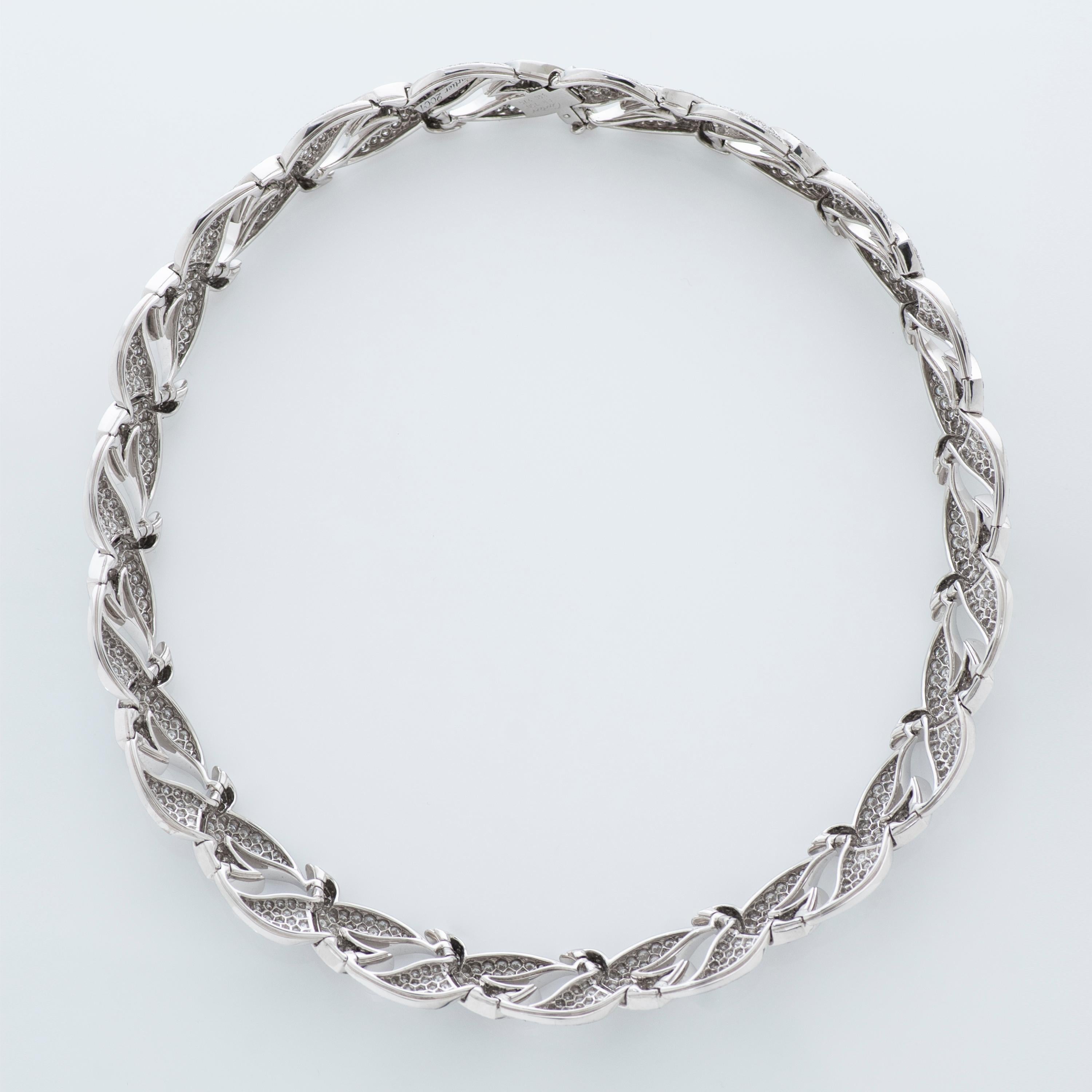 Cartier 18k white gold Dove of Peace necklace accompanied by Cartier box and Cartier certificate of authenticity. 

This necklace features 19 interlocking dove links pave set with approximately 25.25 carats of round brilliant cut diamonds.

Fits up