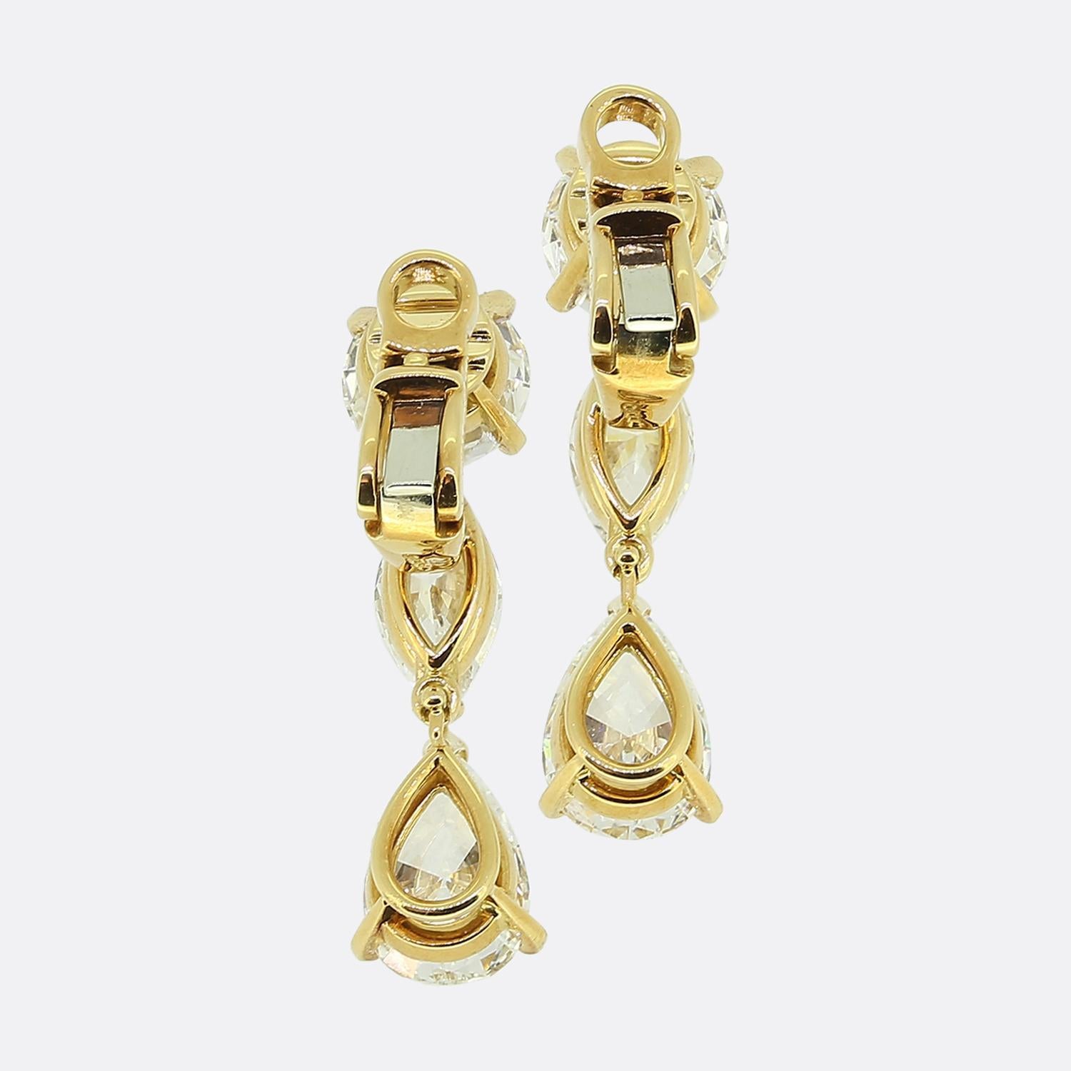 Here we have a truly exceptional pair of diamond drop earrings from the world renowned jewellery house of Cartier. Each piece has been crafted from 18ct yellow gold and showcases a trio of natural diamonds falling vertically in a single line