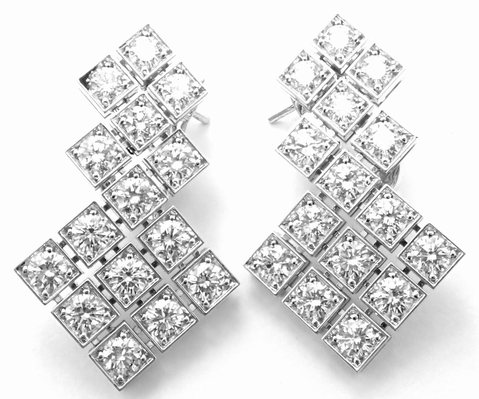 18k White Gold Diamond Drop Earrings by Cartier. 
With 30 round brilliant cut diamonds VVS1 clarity, E color total weight approximately 4.5ct
These earrings are in mint condition and come with original Cartier box and GIA paper for one round