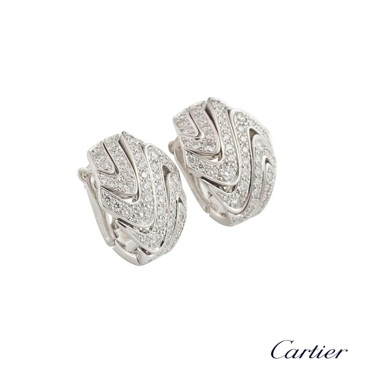 A sparkly pair of 18k white gold diamond Cartier hoop earrings. The earrings each comprise of 6 wave motifs graduating in size with 55 round brilliant cut diamonds. The diamonds have a total weight of approximately 1.74ct, F+ colour and VS+ clarity.
