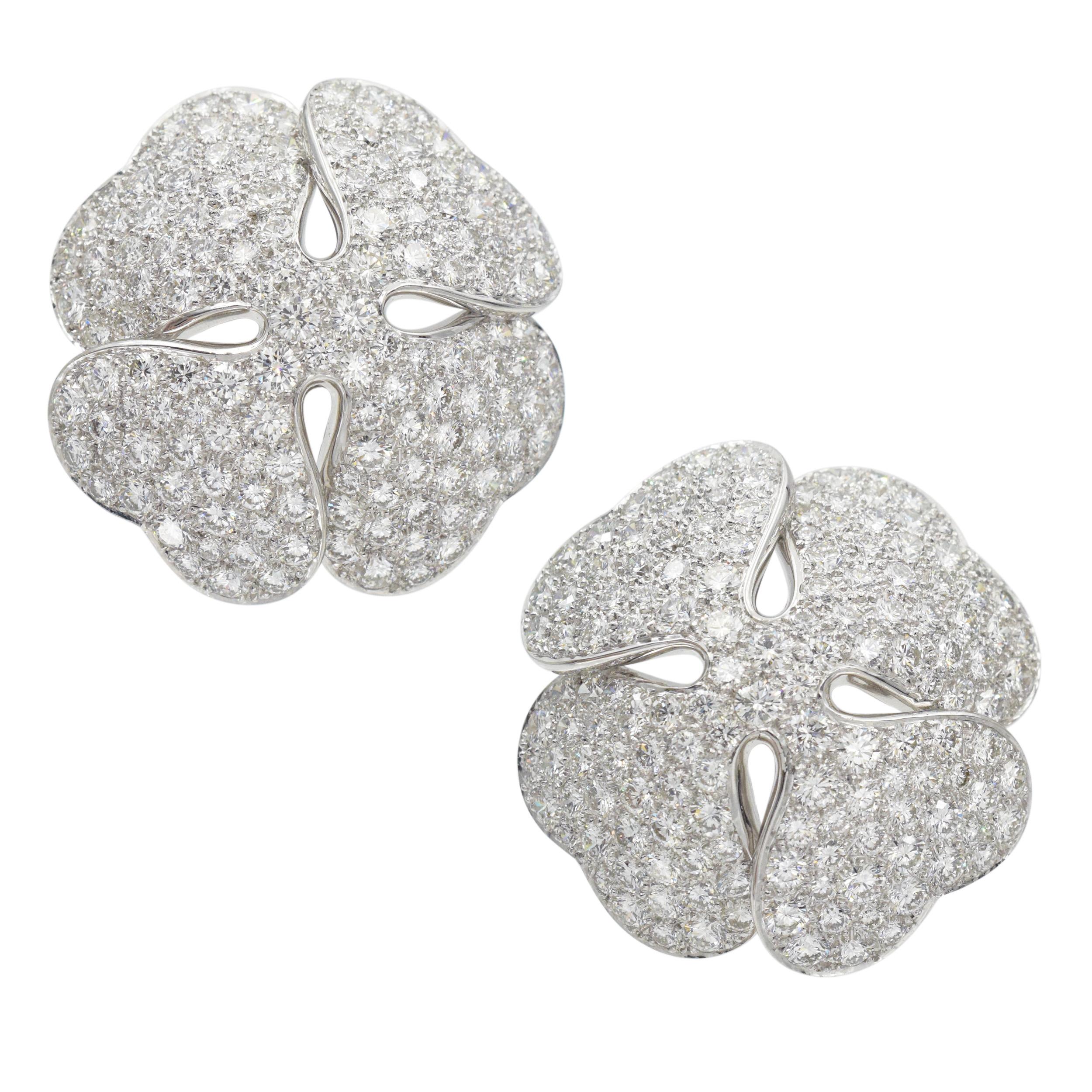 Cartier Anniversary Edition Diamond Clover Earrings in 18k white gold. The earrings are crafted in a four leaf clover design. Encrusted with round brilliant cut diamonds with total
weight of approximately 14.00ct, color E-F, clarity VS. Equipped