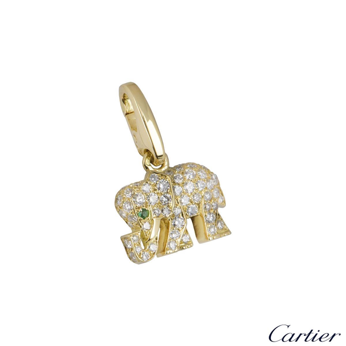 An 18k yellow gold diamond Cartier charm. The charm comprises of an elephant motif encrusted with approximately 60 round brilliant cut diamonds with a total weight of approximately 0.40ct. The charm has a round cut emerald set for the eye on the
