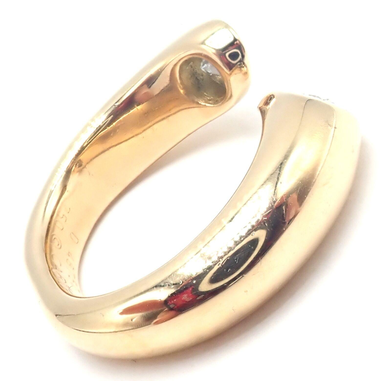 18k Yellow Gold Ellipse Deux Tetes Croisees Bypass Diamond Band Ring by Cartier.
With 2 oval cut diamonds VS1 clarity, G color total weight approximately 1.20ct
Embrace the pinnacle of luxury with Cartier's 18k Yellow Gold Diamond Ellipse Deux Tetes