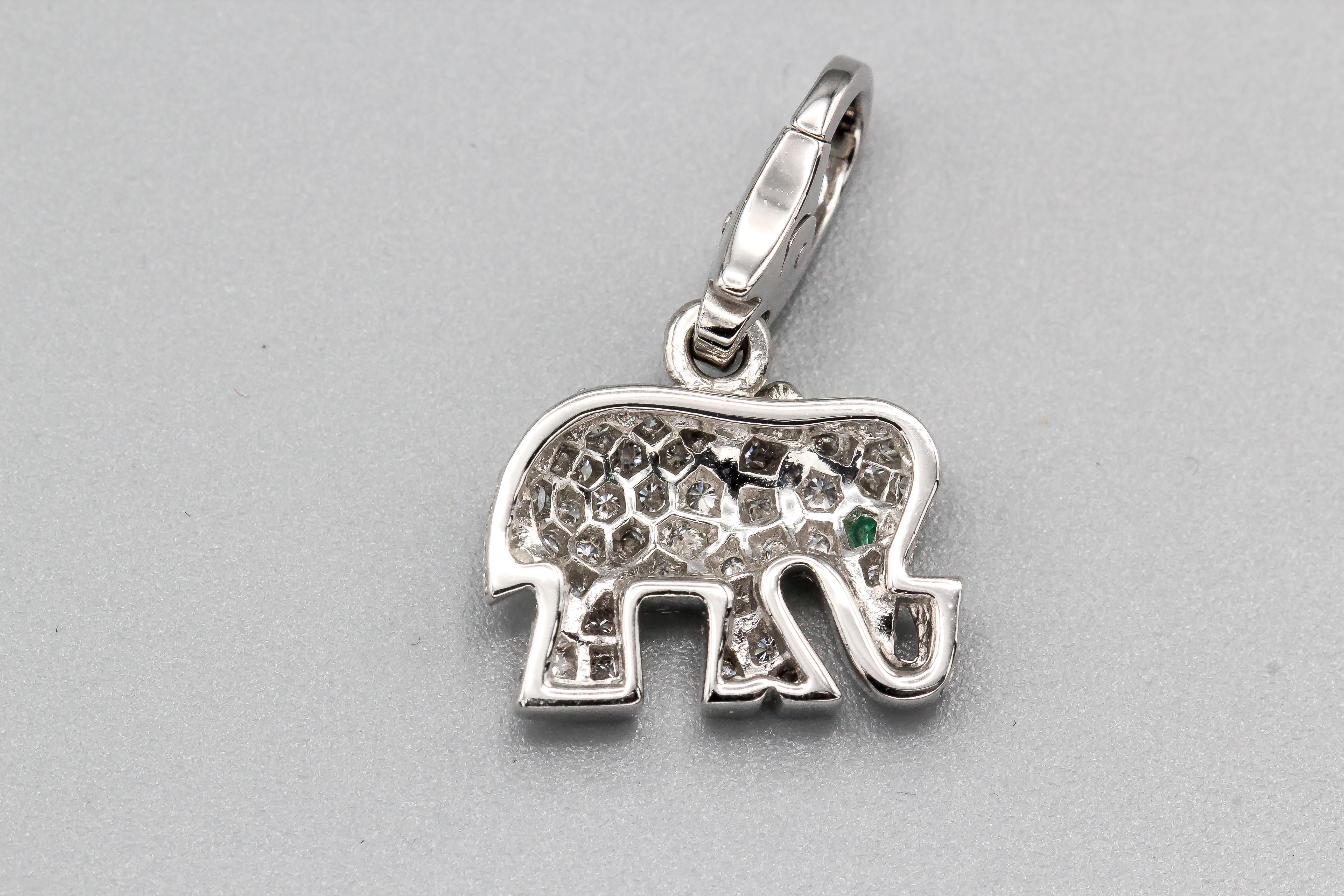 Fine diamond, emerald and 18K white gold elephant charm by Cartier.  Well made and easy to add to any bracelet or pendant.

Hallmarks: Cartier, 750 reference numbers, maker's mark, French 18k gold assay marks.