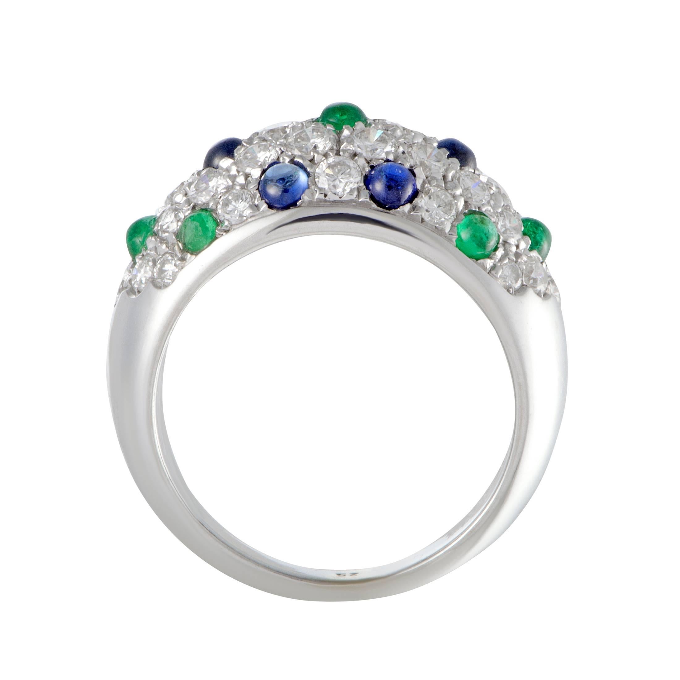 This elegant 18K white gold ring by Cartier features an exquisitely captivating style. The remarkable ring is adorned in 1.75ct of dazzling diamonds, 0.50ct of mesmerizing green emeralds and 0.75ct of stunning blue sapphires that accentuate the