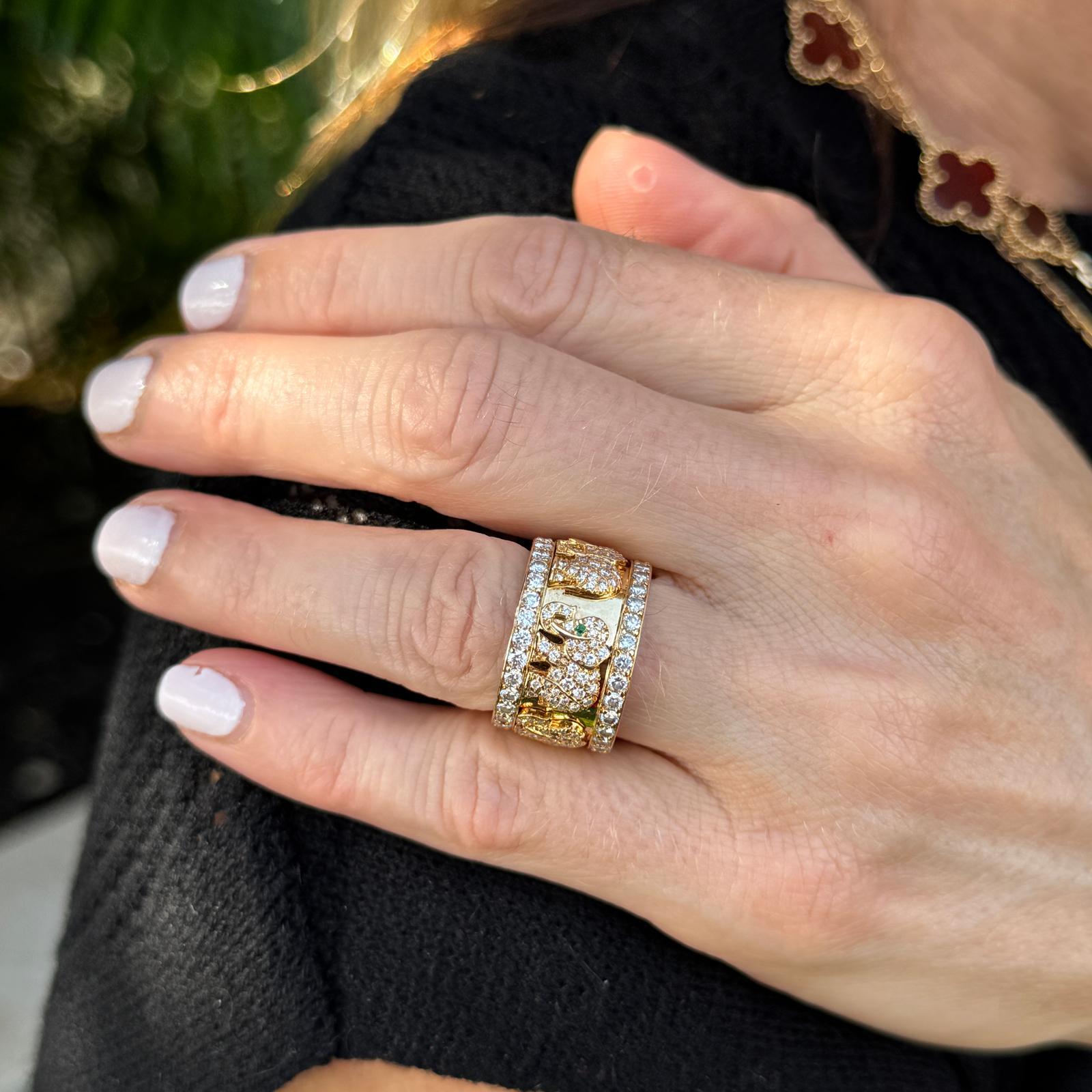 This stunning 18k yellow gold Cartier elephant ring features a captivating design, set with approximately 3.50 carats total weight of diamonds in D-E color and VVS clarity, offering exceptional brilliance. The ring is beautifully accented with