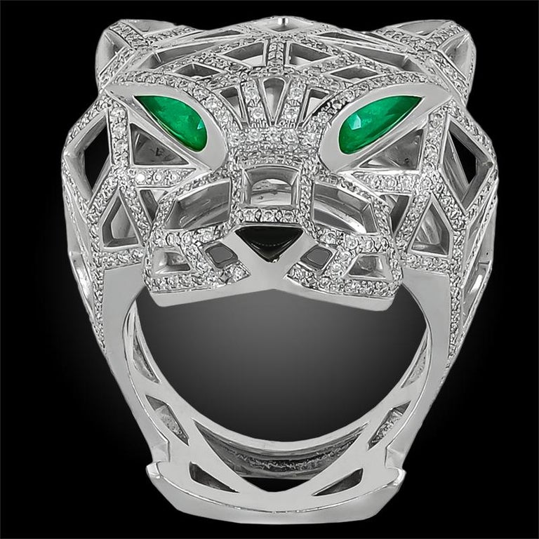Cartier Panthere Diamond Openwork Panther Head Ring in 18k White Gold.

A stunning structure of openwork fashioned in diamond pavé, this iconic Panthère de Cartier ring is accented with emerald eyes and custom-carved onyx cabochon nose. Currently a