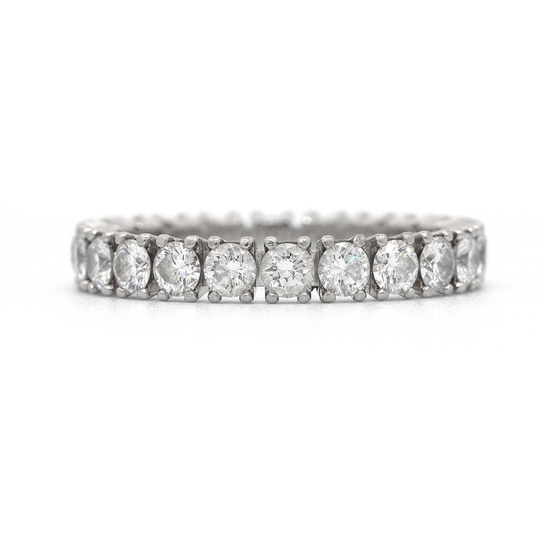 Platinum Diamond Eternity Band Ring by Cartier.
With 22 round brilliant cut diamonds total weight 1.52 carats. 

Ring Size: US 5.5

Stamped Hallmarks: Cartier 950pt 5 74044 b 1.52

Every Upper-Luxury piece will arrive in an elegant jewelry box.

