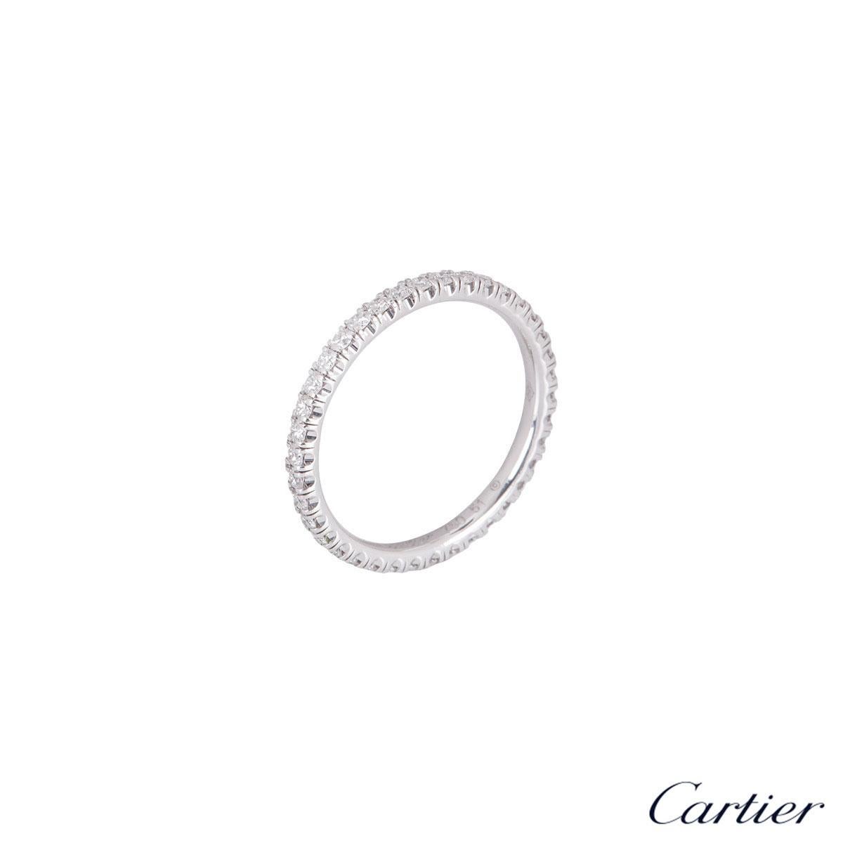 An alluring 18k white gold diamond eternity ring by Cartier from the Étincelle De Cartier collection. The ring comprises of 38 round brilliant cut diamonds with a weight of 0.47ct in a shared 4 claw setting all the way round. The ring is a size UK L