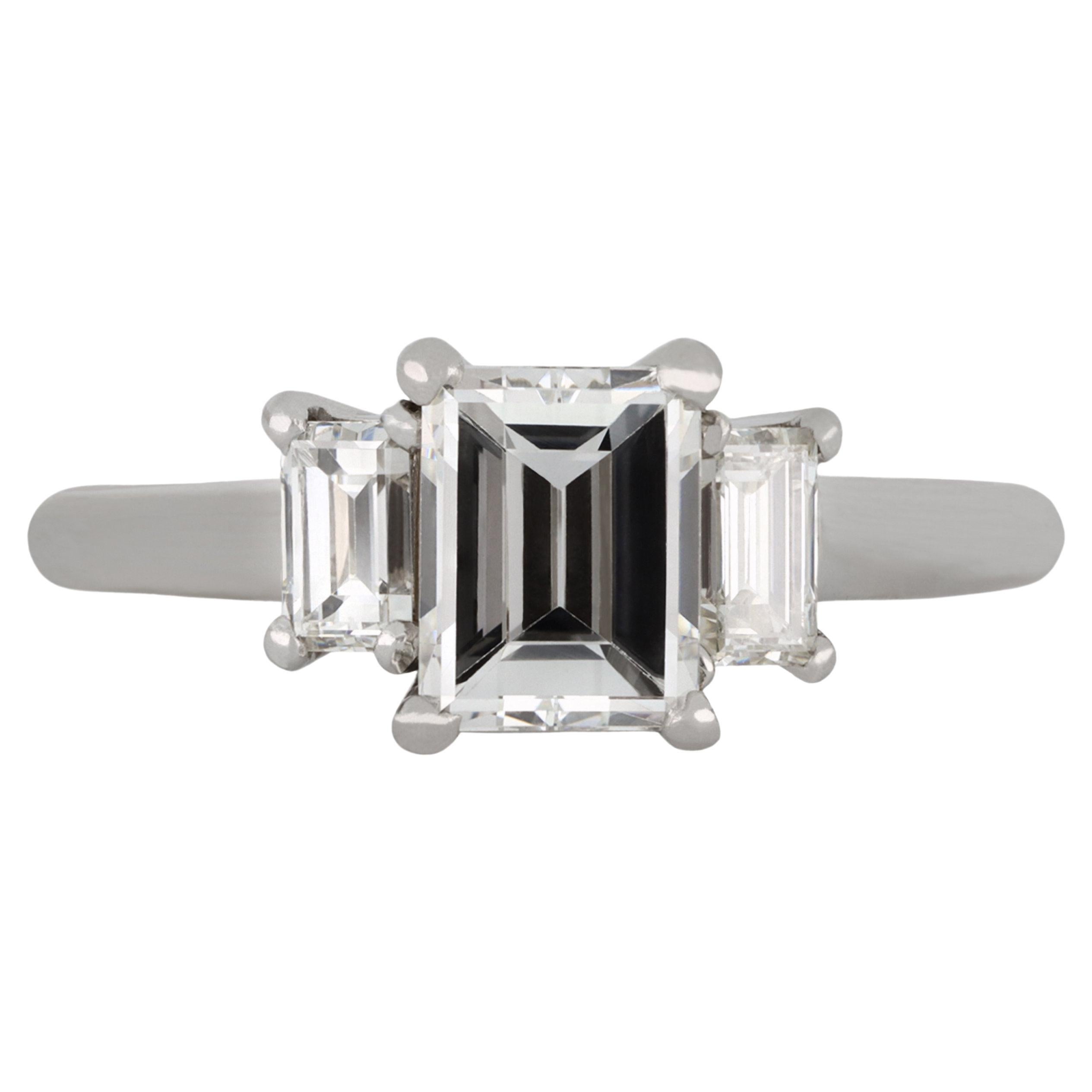 Cartier diamond flanked solitaire ring, circa 1960 For Sale