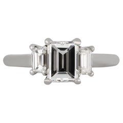 Retro Cartier diamond flanked solitaire ring, circa 1960