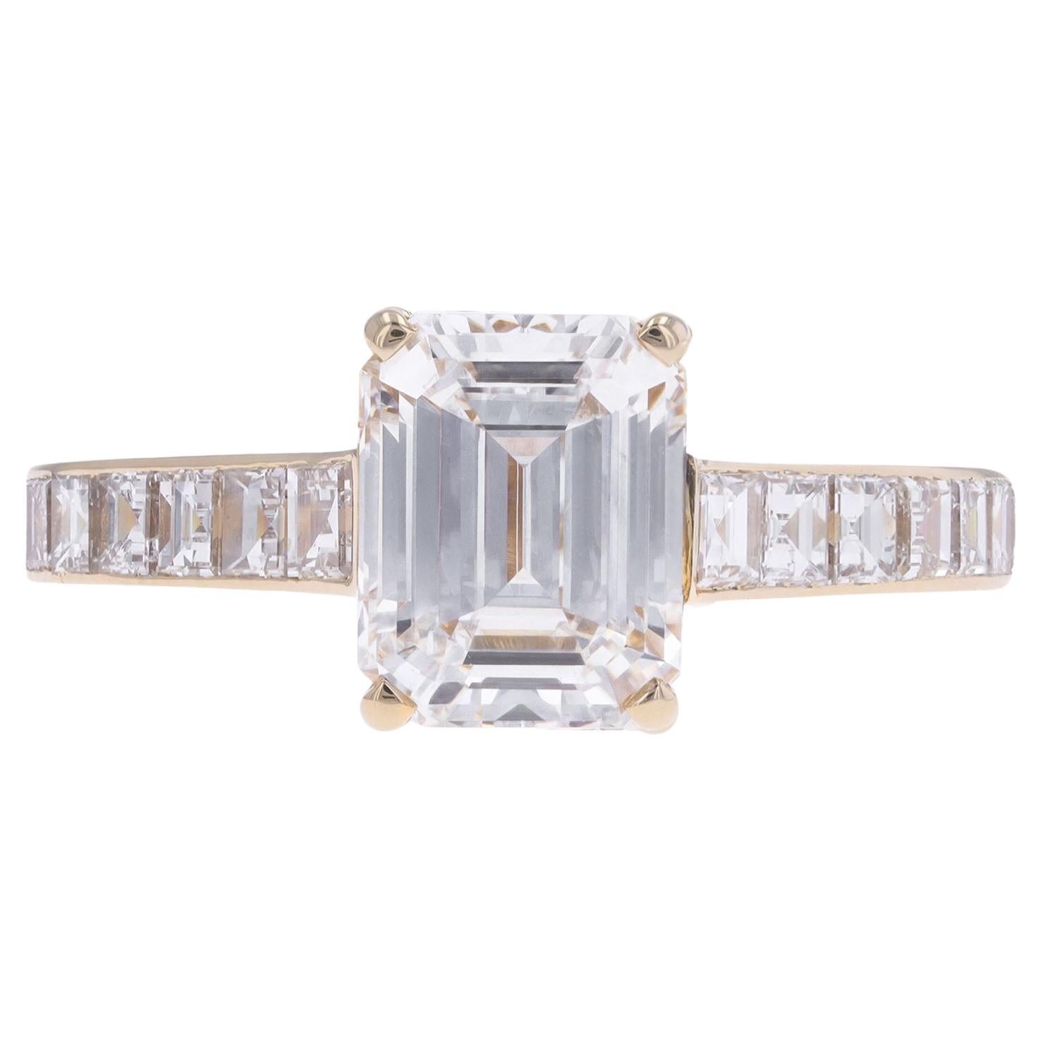 Cartier diamond flanked solitaire ring, French. For Sale