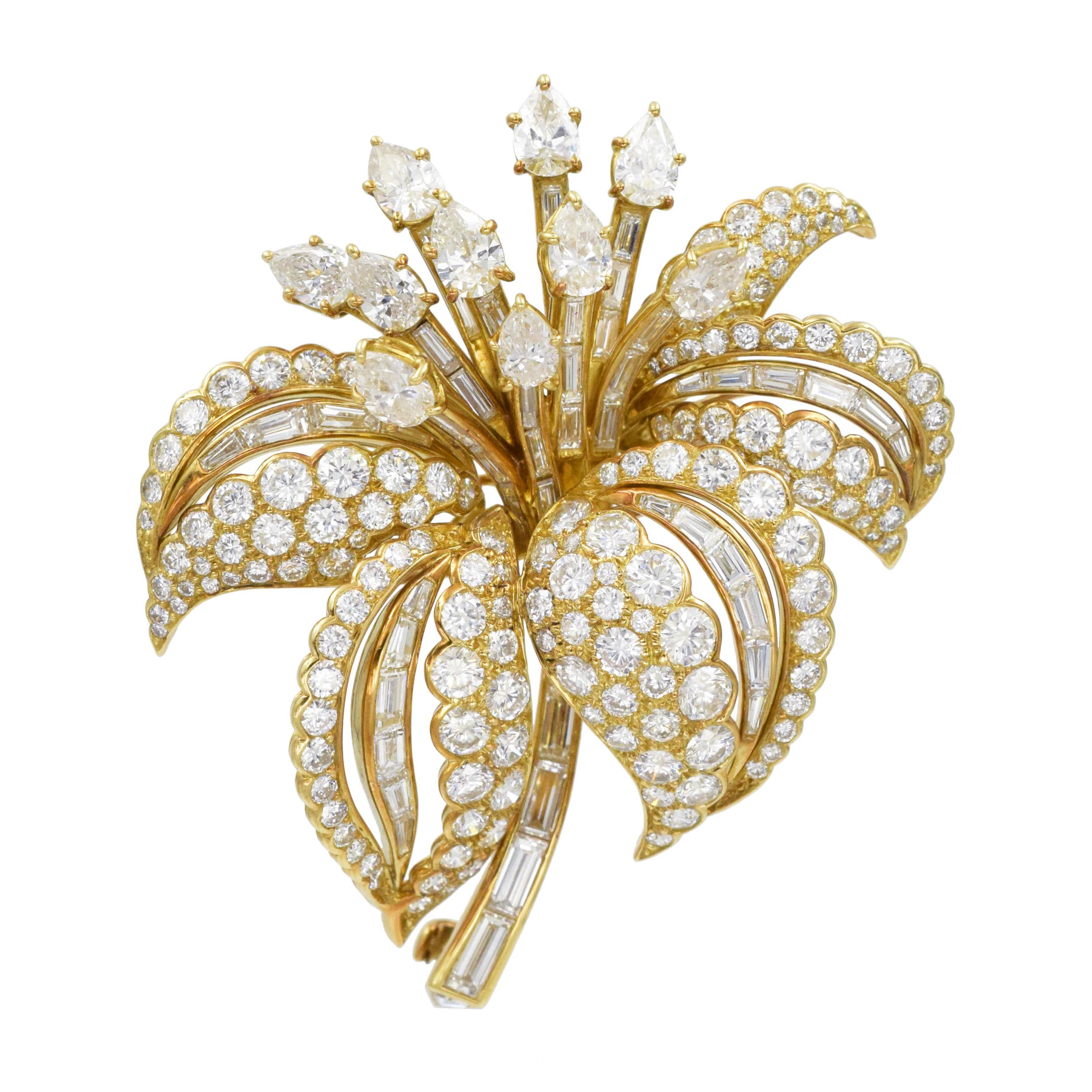 Cartier diamond flower brooch in 18k yellow gold. 
This brooch consists of 10 pear shape diamonds with total weight of approximately 2.50ct , 163 round brilliant cut diamonds with total weight of approximately 6.00ct, 57 tapered and straight